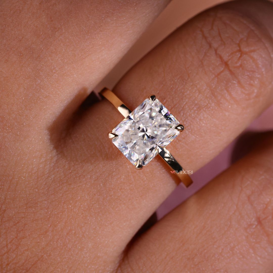 Radiant cut moissanite ring gold featuring a brilliant cut stone.