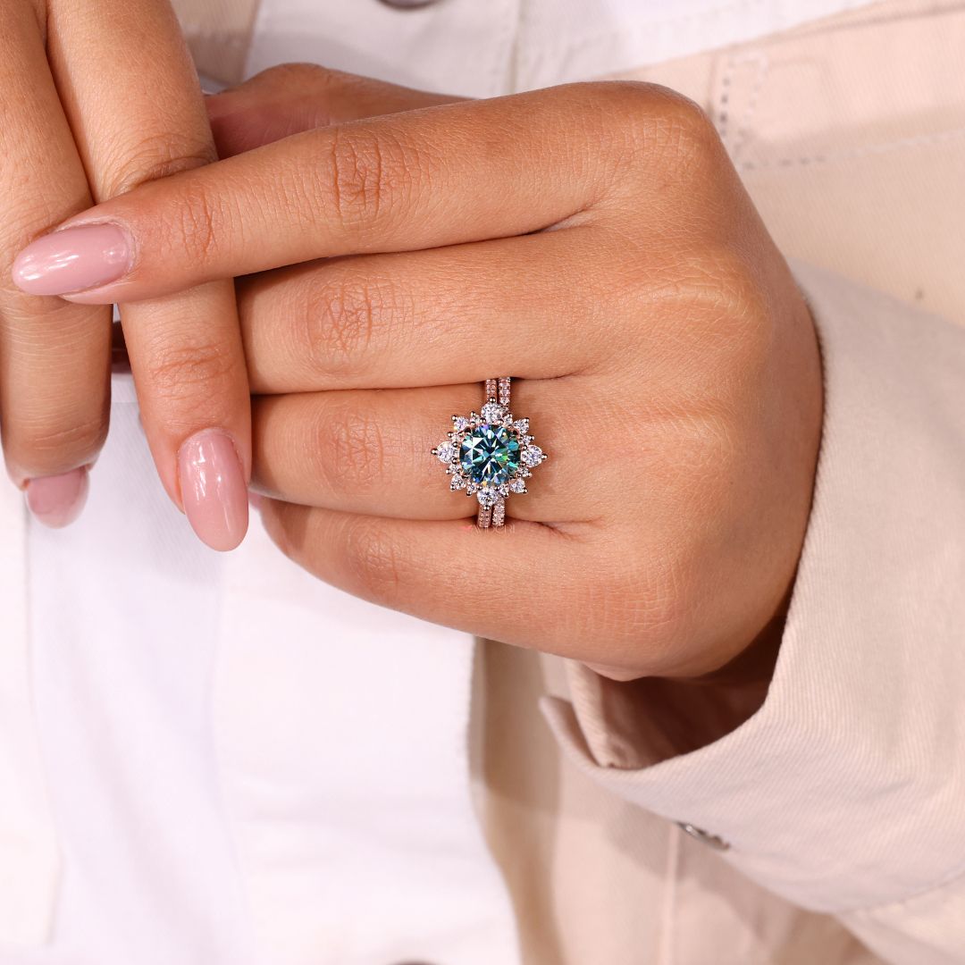 Round Cut Moissanite Wedding Band complements the engagement ring.