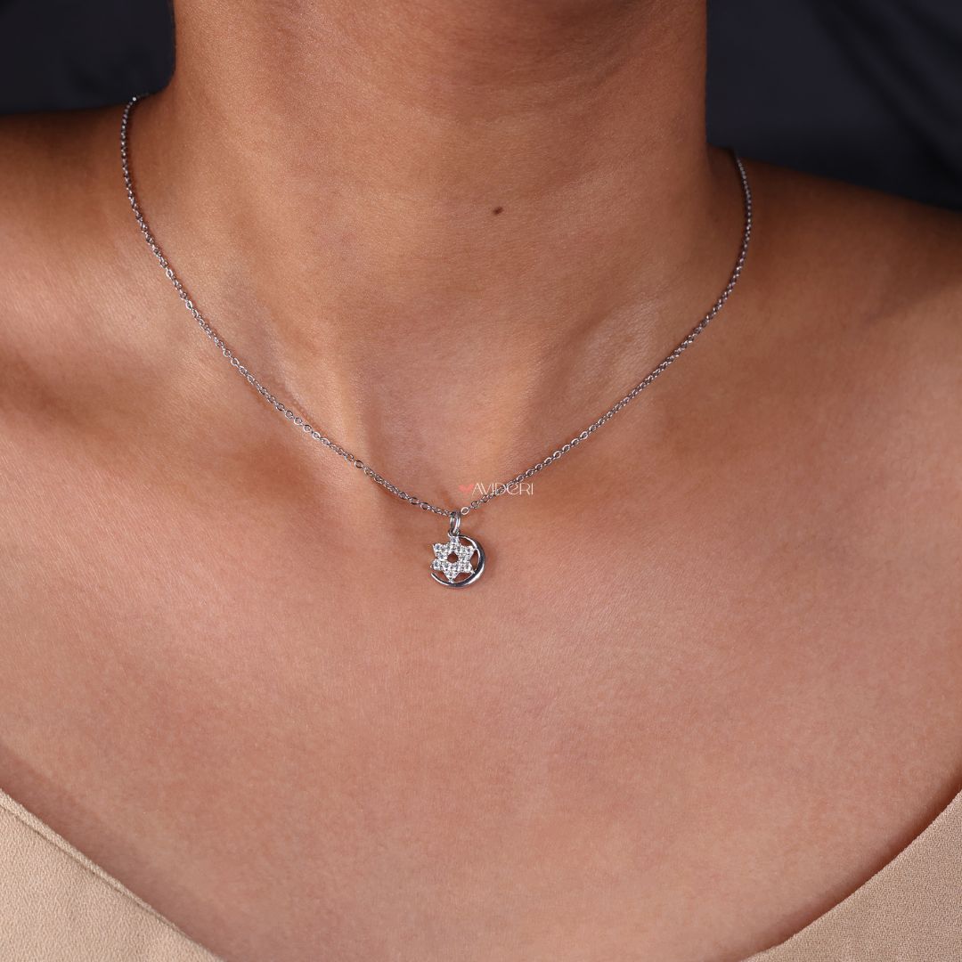 White gold pendant featuring a celestial-inspired design