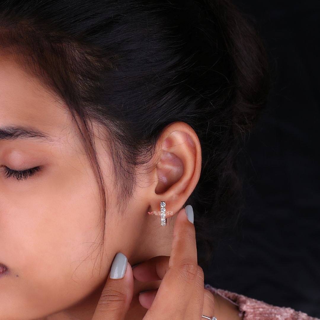 Gold hoop earrings with IGI certified stones