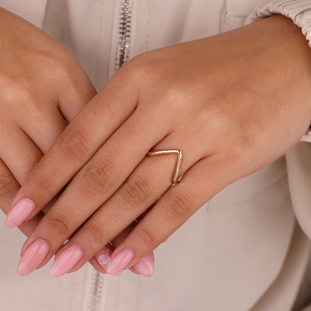 Yellow gold engagement ring with a classic V shaped band