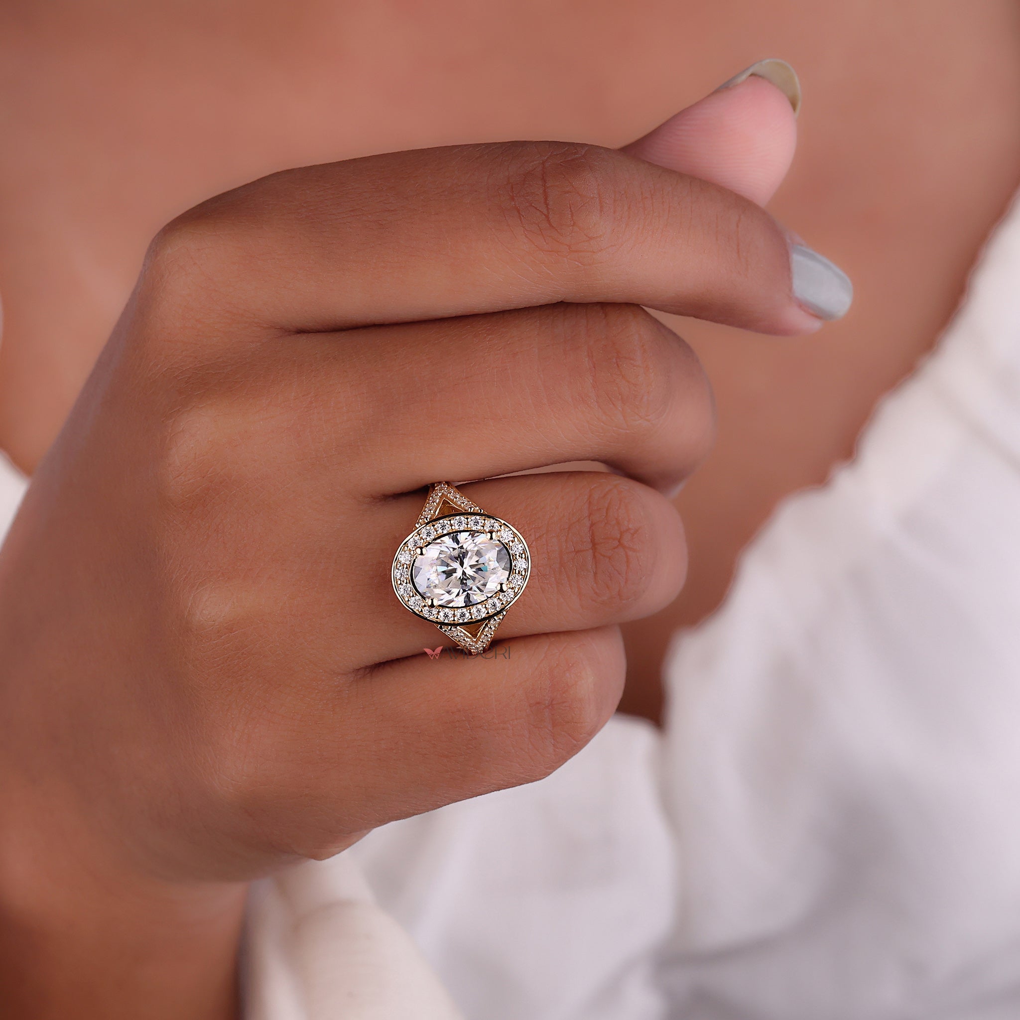 Four claw prong set engagement ring for secure stone placement.