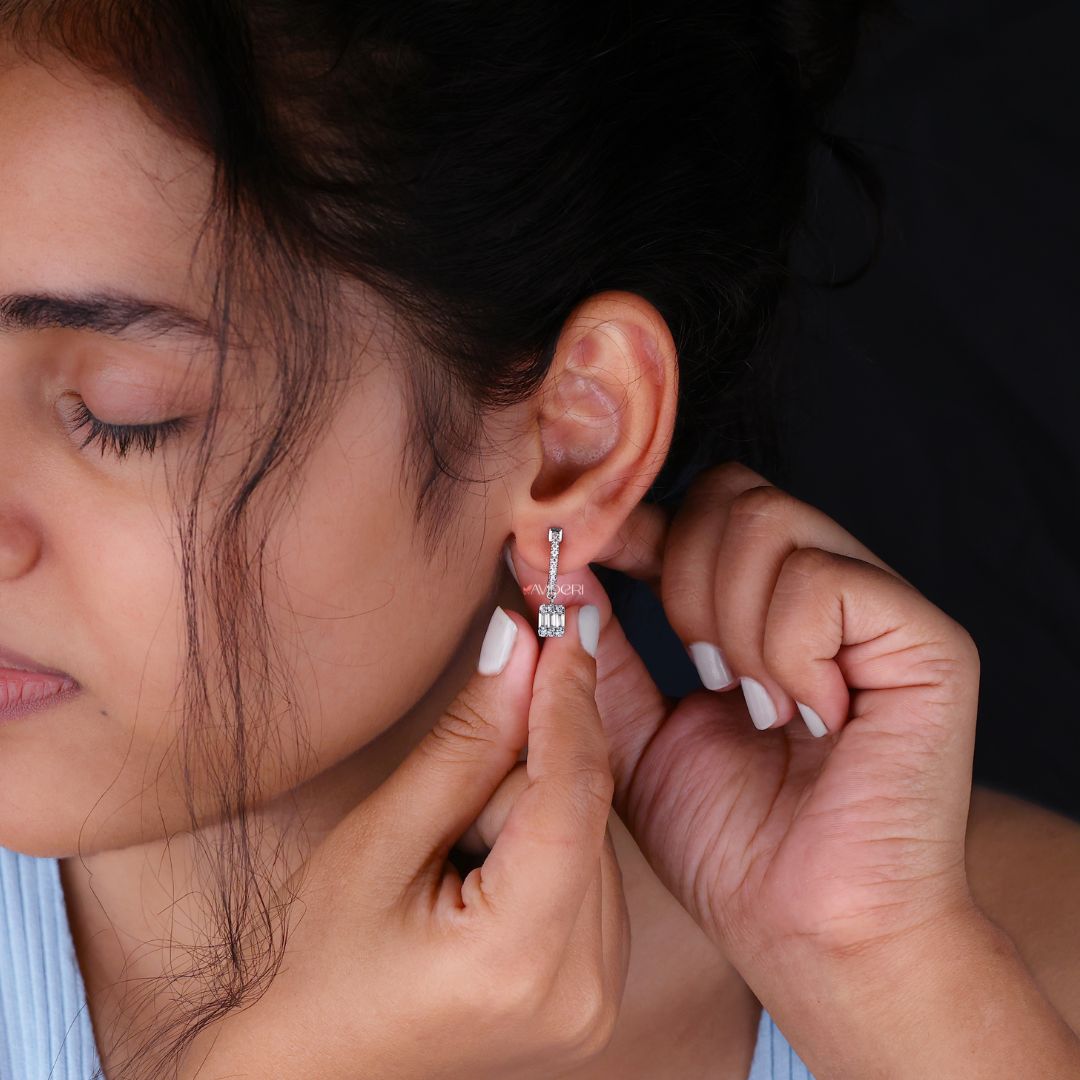 Earrings with baguette cut Moissanite and round cut stones for a radiant finish.