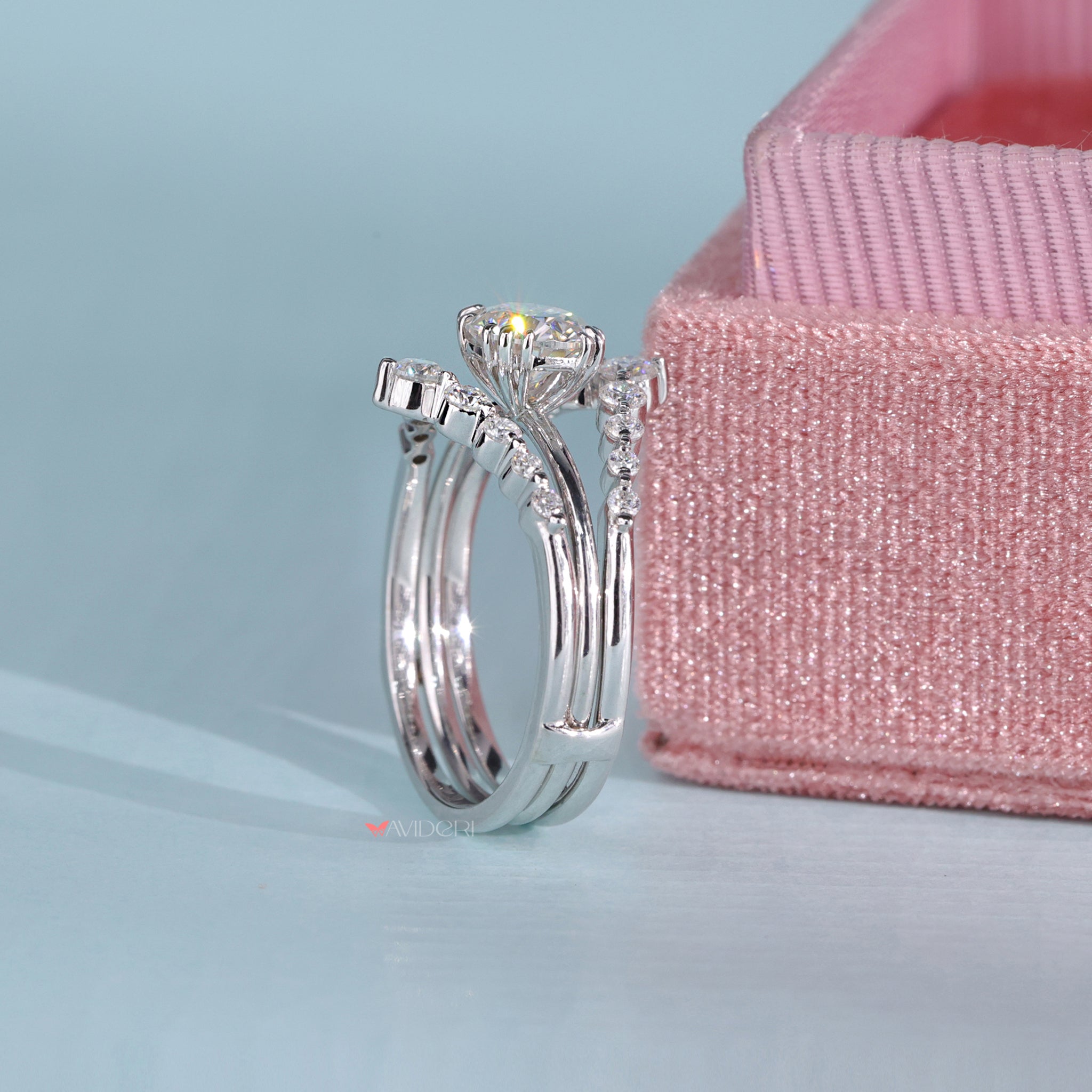 Gold Guard Wrap Band surrounding a round cut solitaire.