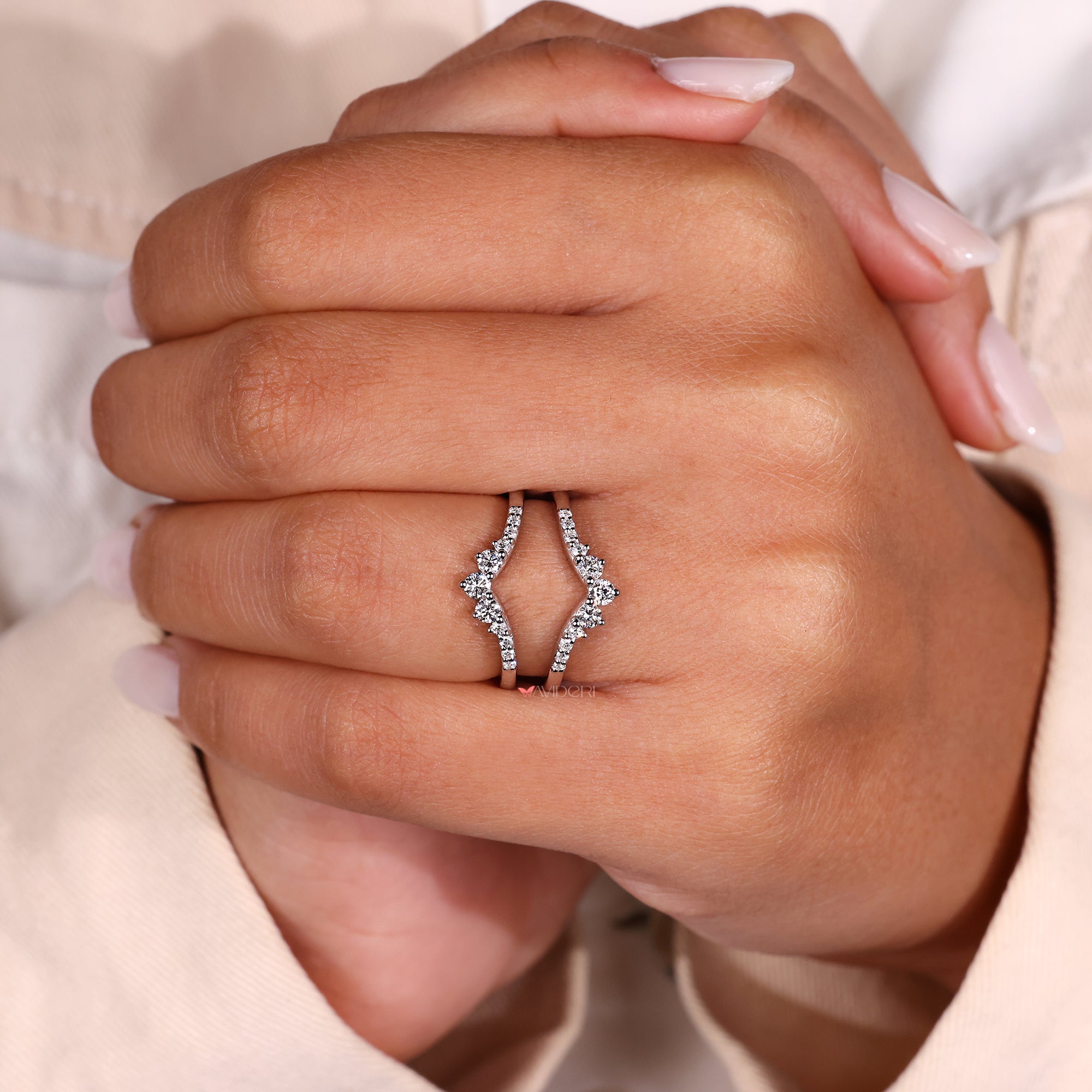 Wedding band with curved wrap design and lab diamonds.