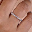Half eternity wedding ring shows balanced shine with a sleek, lightweight design.