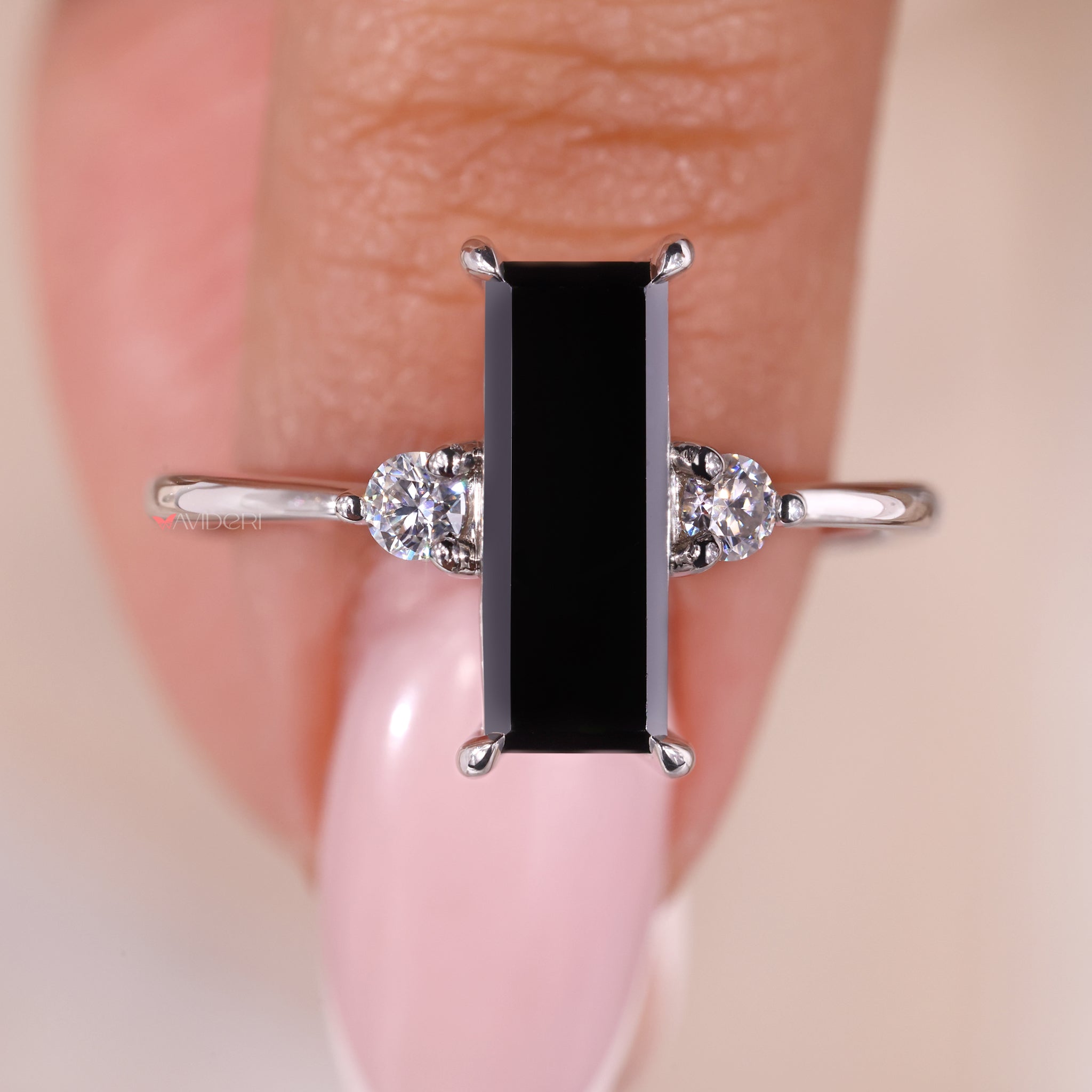Black moissanite ring paired with a white gold band