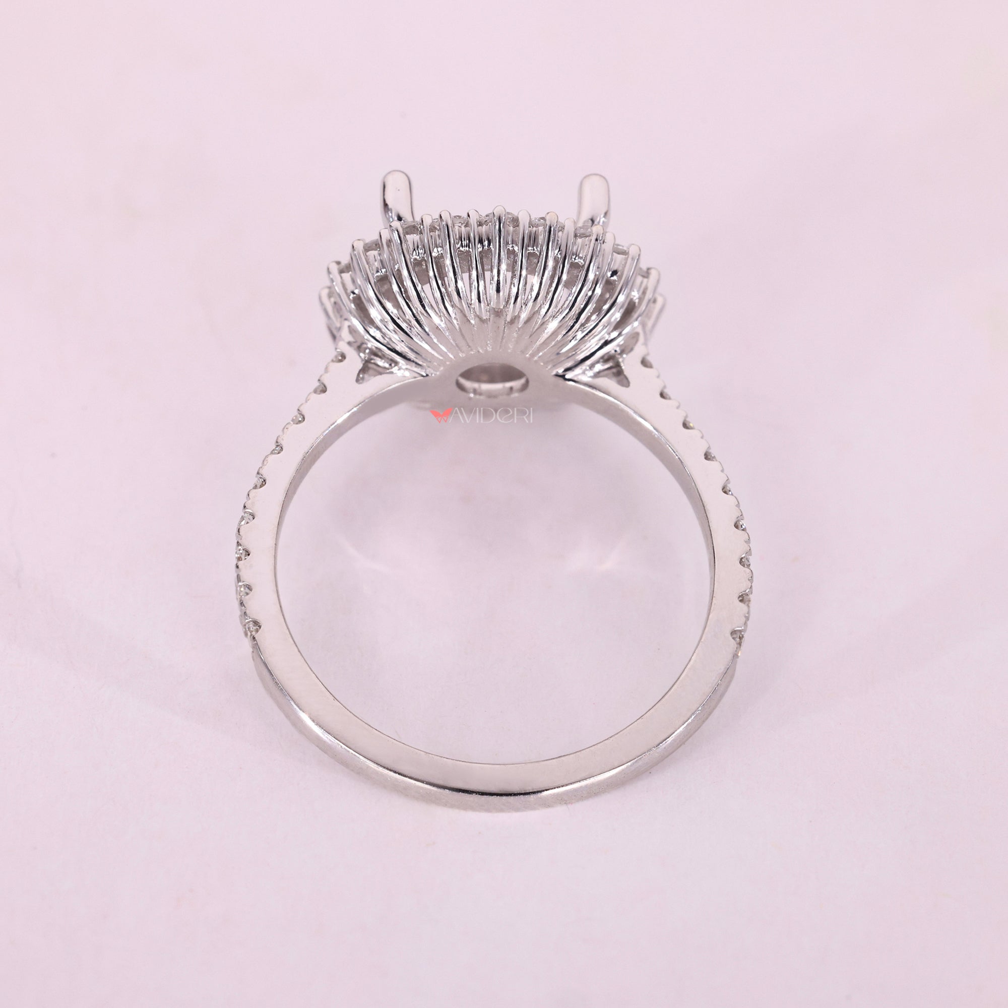 White gold semi mount ring with four prong setting.