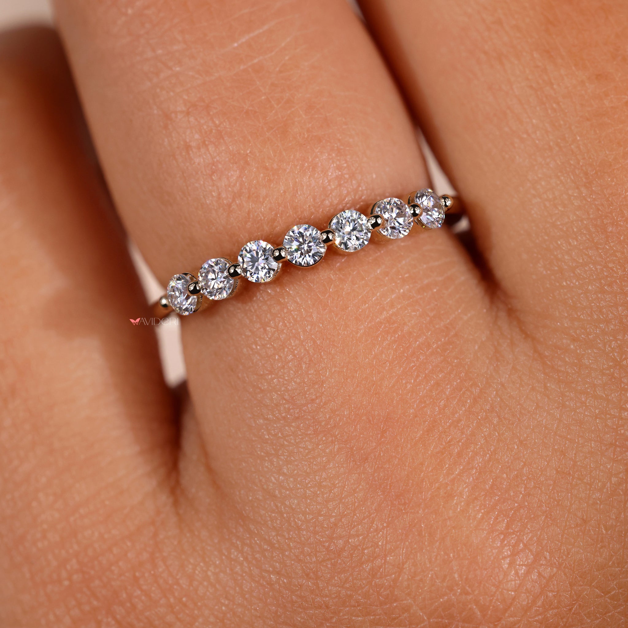 Elegant half eternity ring with lab-grown diamonds set in a sophisticated design.