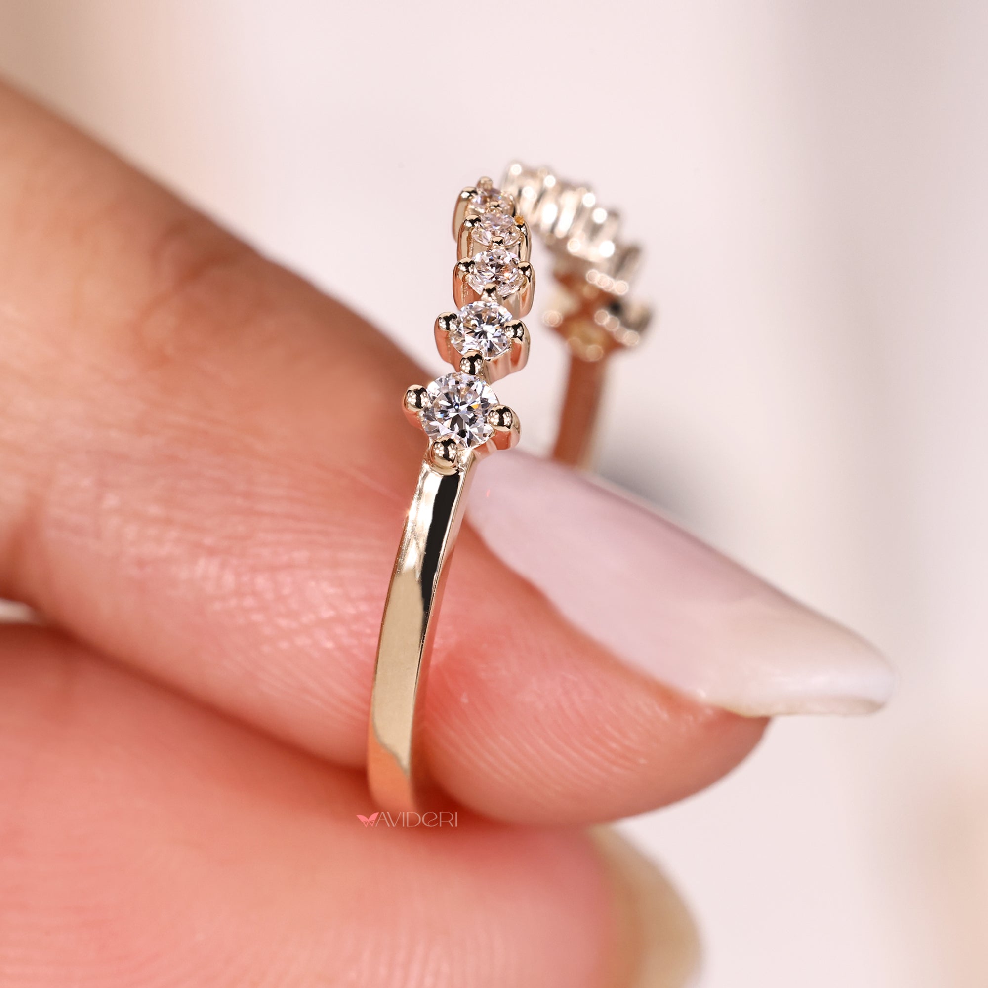 Half eternity band with shared prong setting.