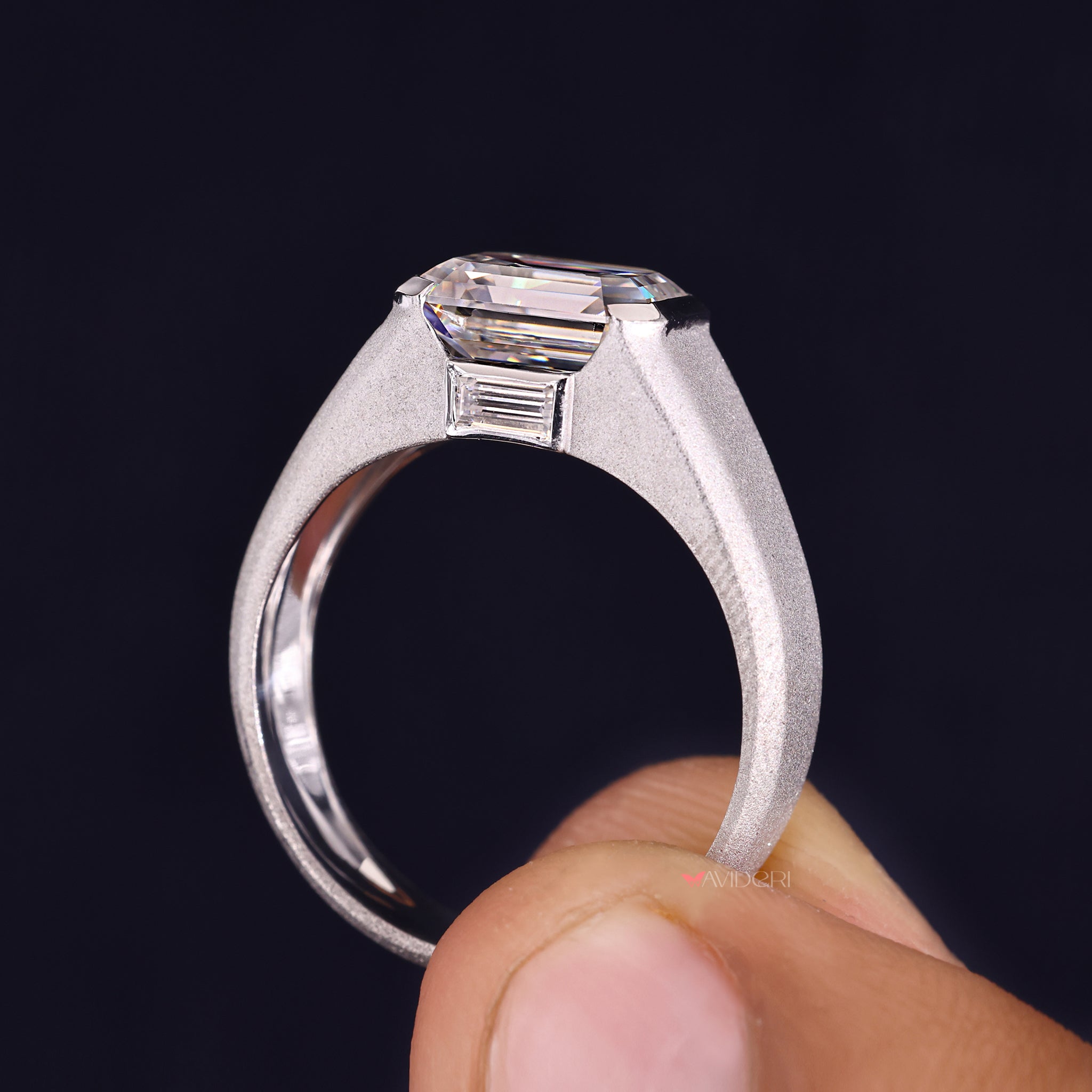 Emerald cut diamond mens ring stands out with bold and sharp details.