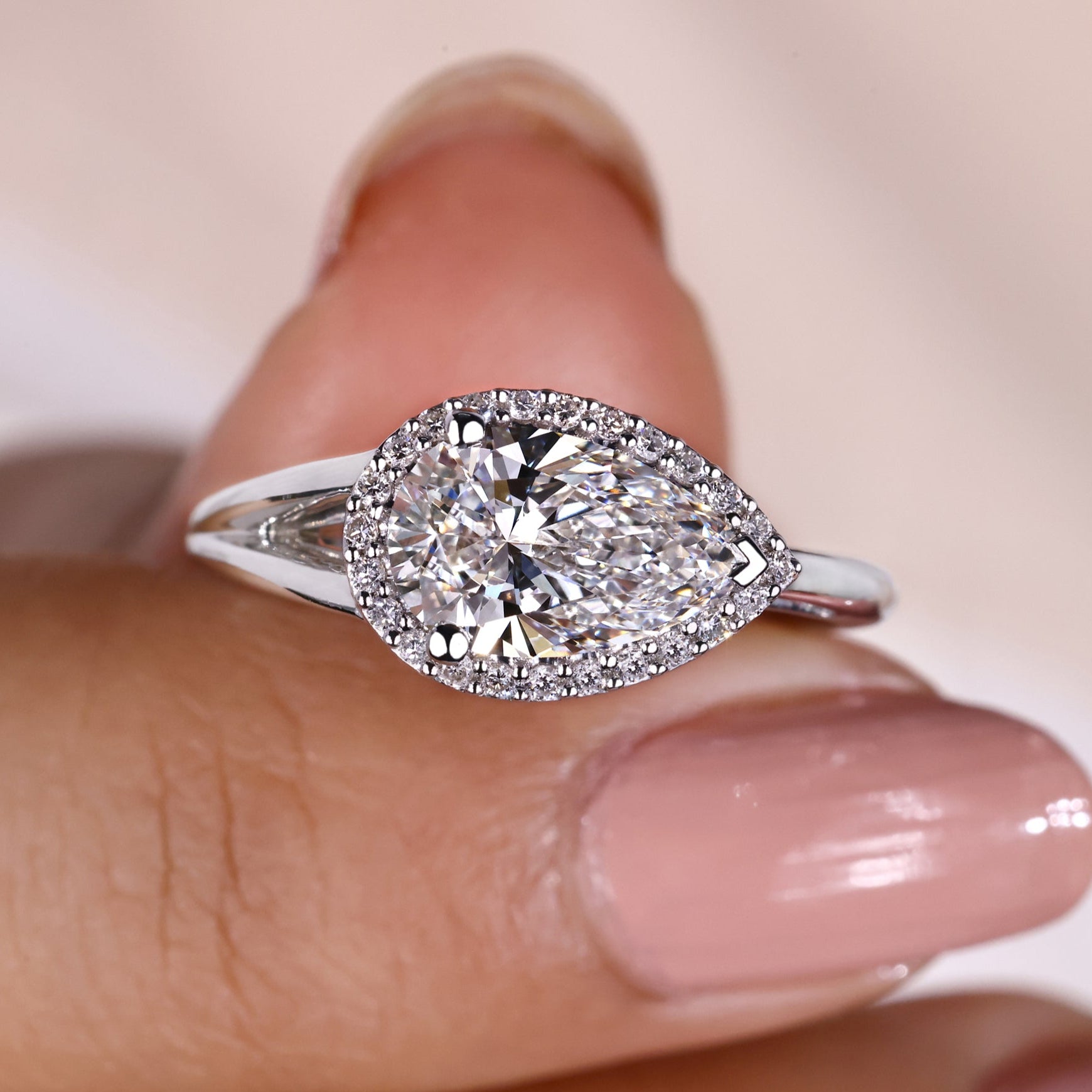 Pear shaped diamond ring with a lab-grown diamond.