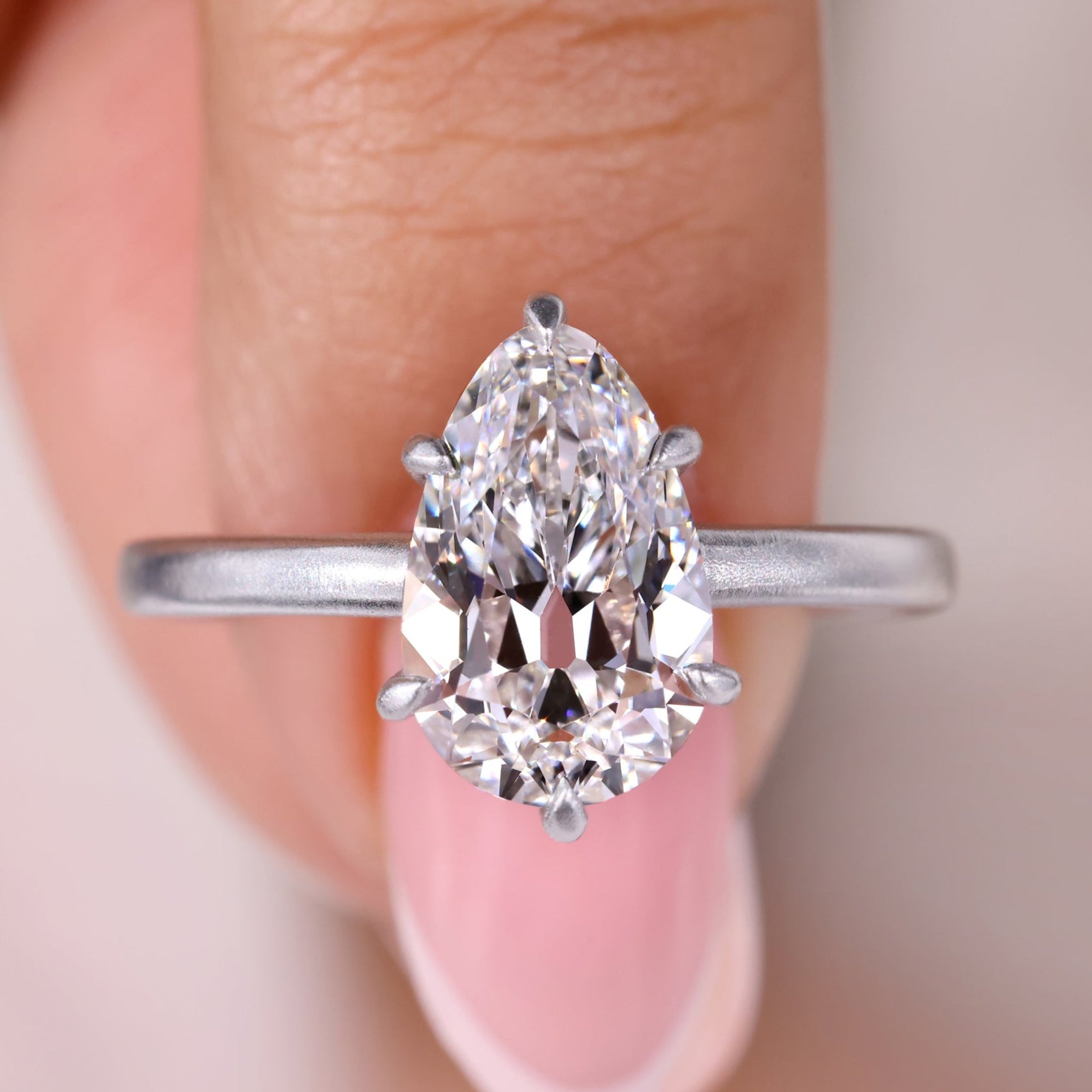 Pear shape engagement ring with a stunning old European cut diamond.