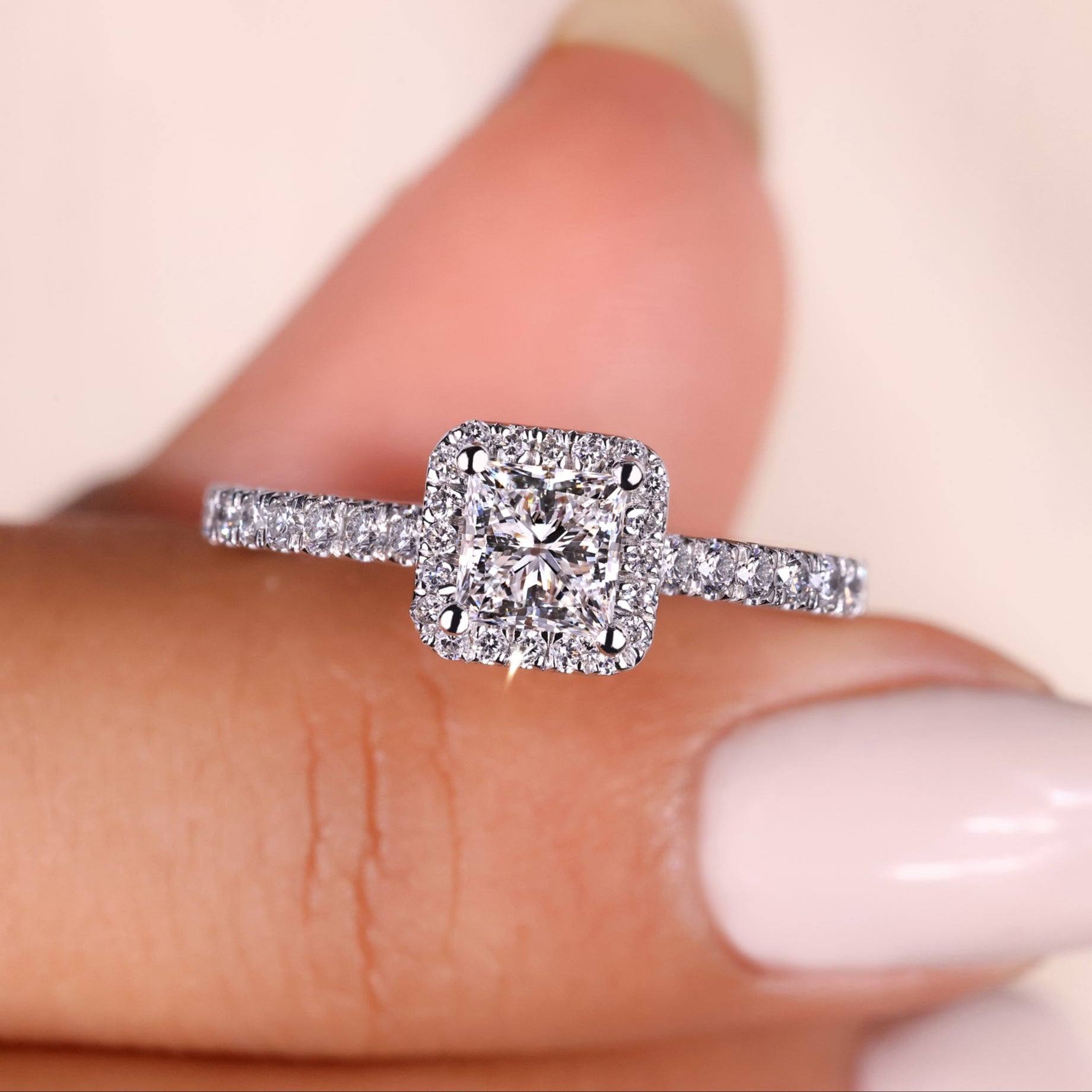 Princess cut halo ring featuring a stunning design with sparkling diamonds, perfect for a timeless and elegant look.