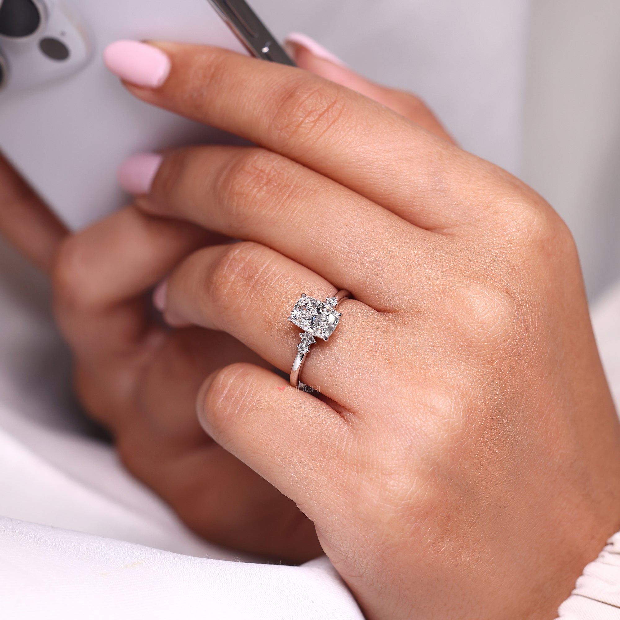 5 stone diamond ring made with 4 claw prong setting.