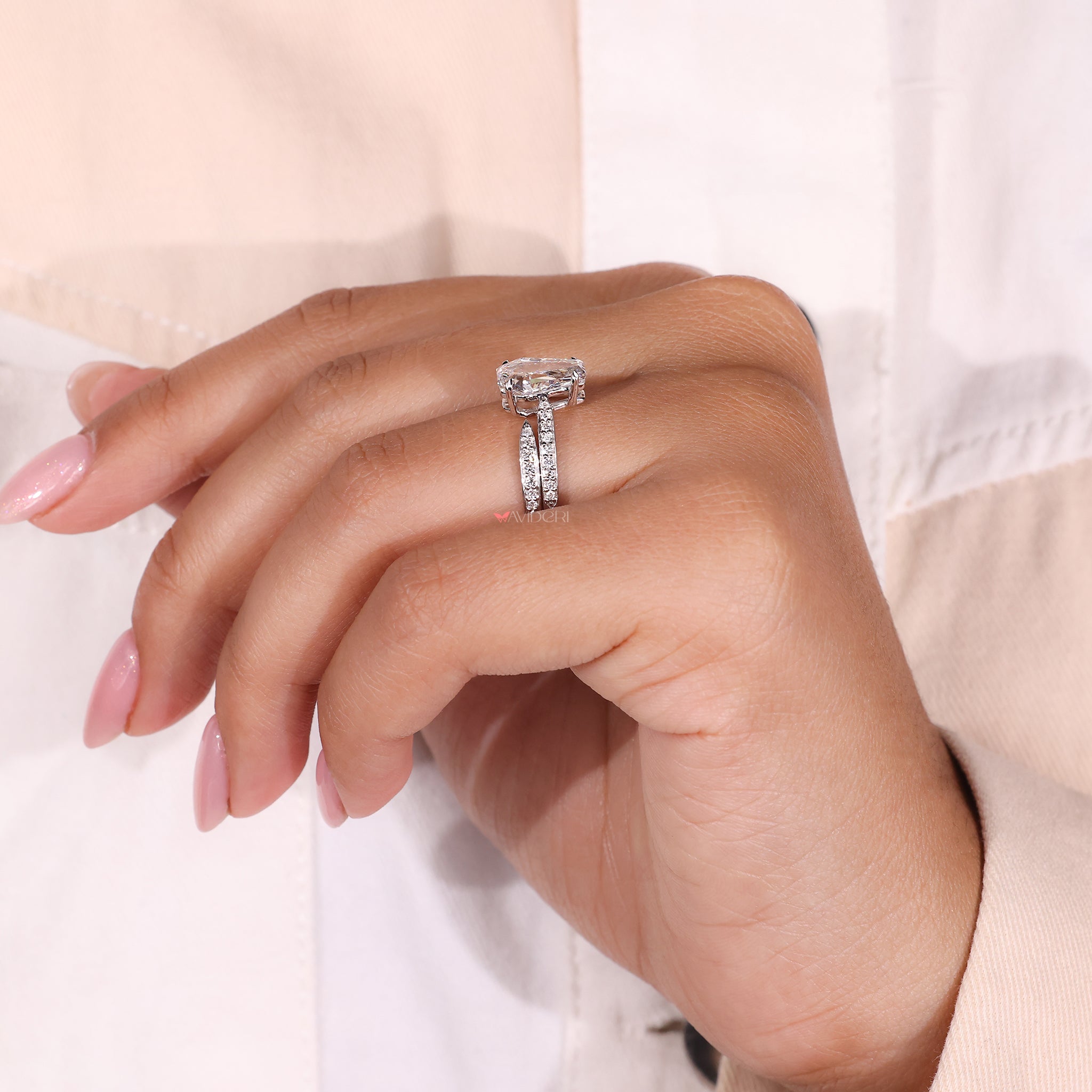 The cathedral style ring features elevated sides for added beauty.