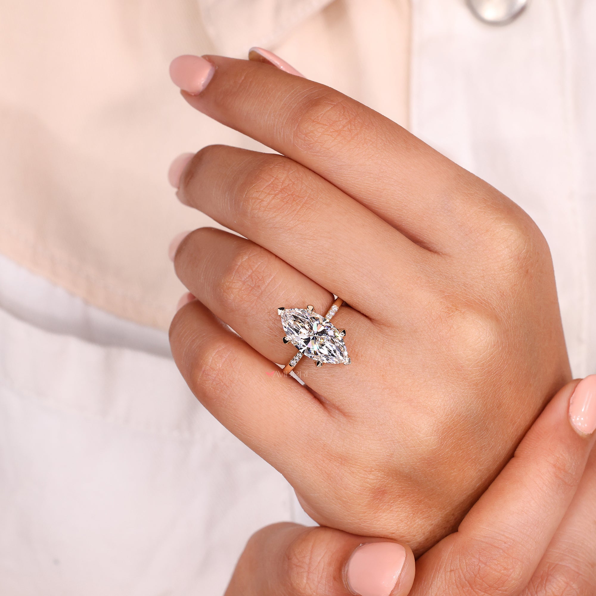 Four claw prong marquise ring in yellow gold.