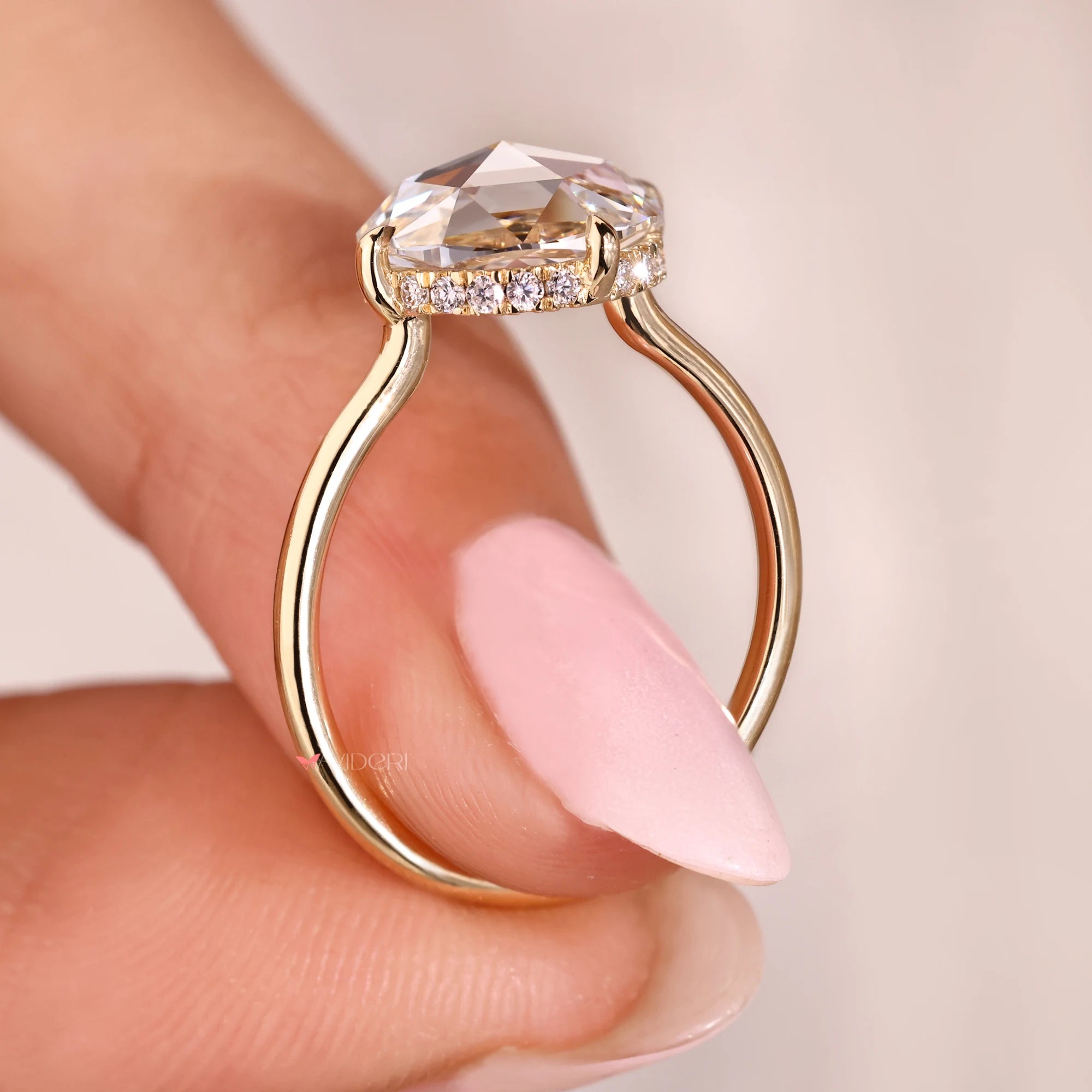 Hidden halo diamond ring with lab-grown diamond ring.