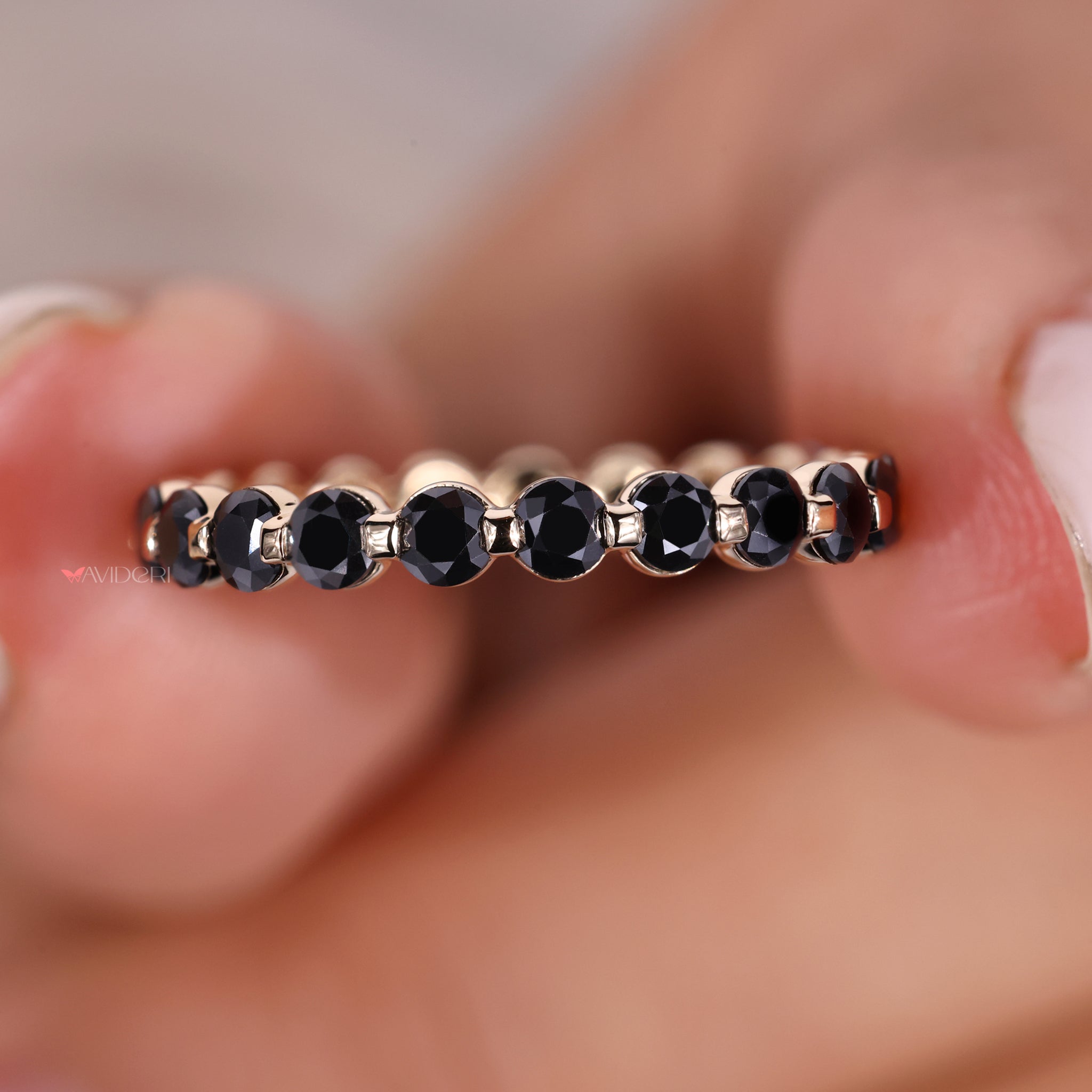 The shared prong band enhances brilliance with closely set stones.