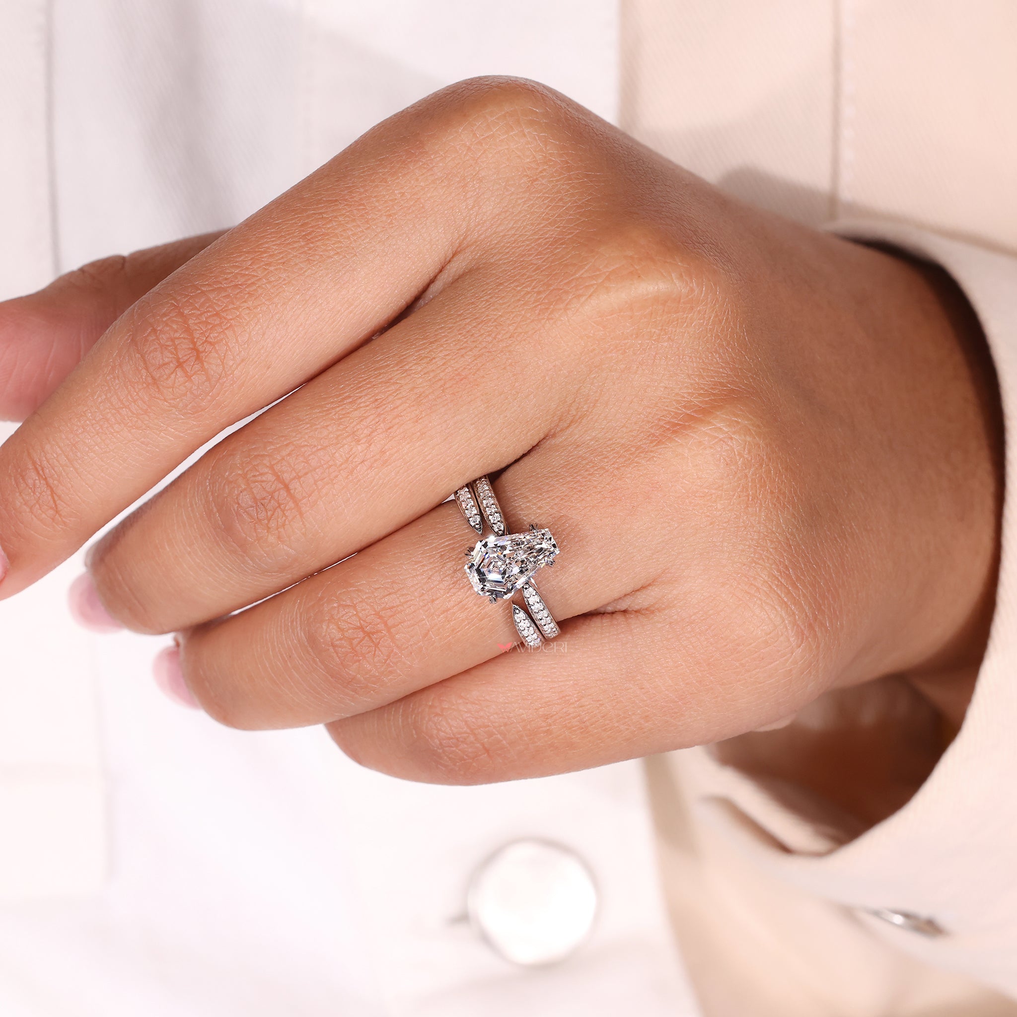 The coffin engagement ring combines bold design with elegance.