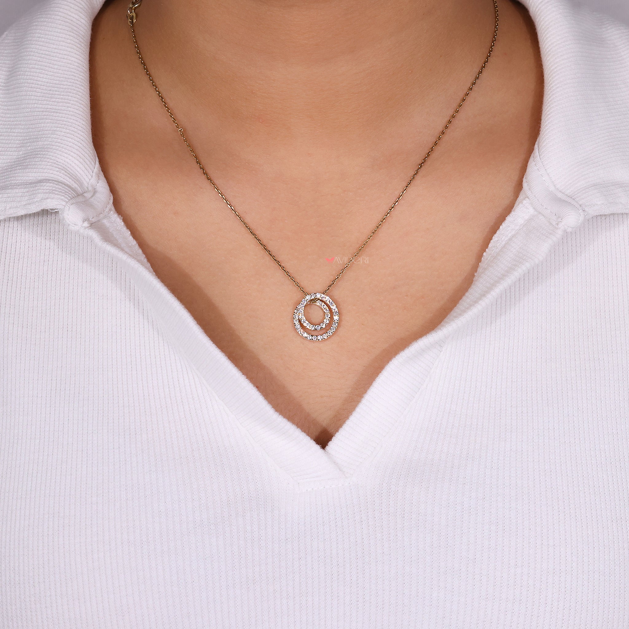 Coiled circle pendant with a round diamond pendant for a unique look.