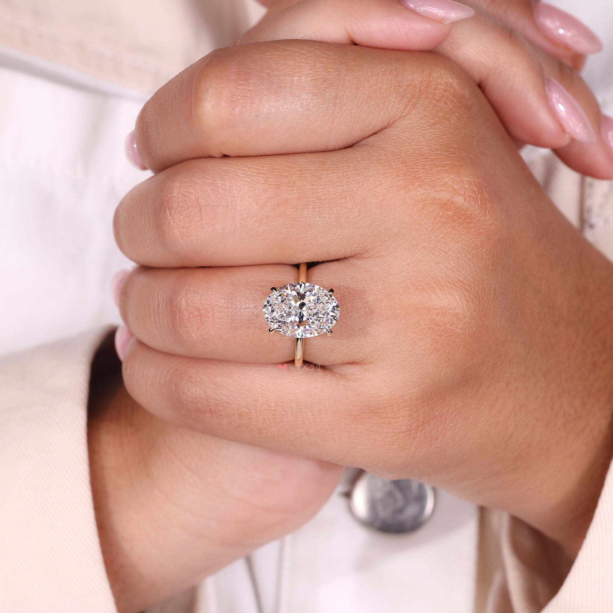 4 Prong Ring featuring an oval cut diamond, designed for durability and elegance.