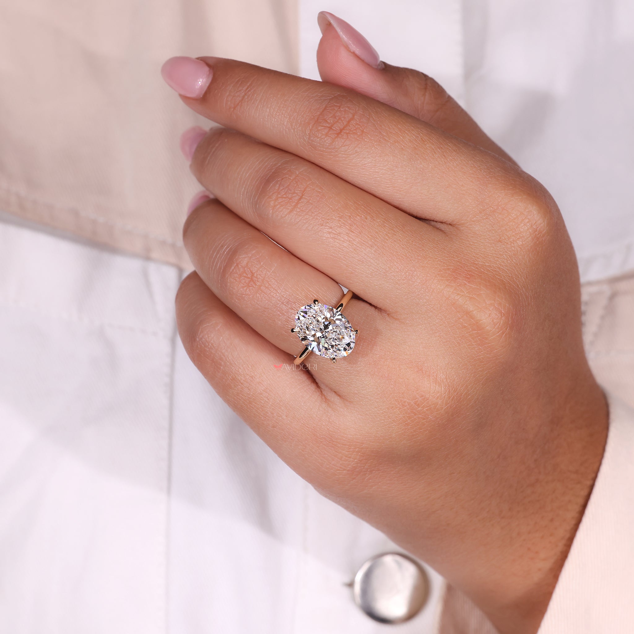 Oval Engagement Ring with a delicate 4 prong setting, perfect for an elegant proposal.