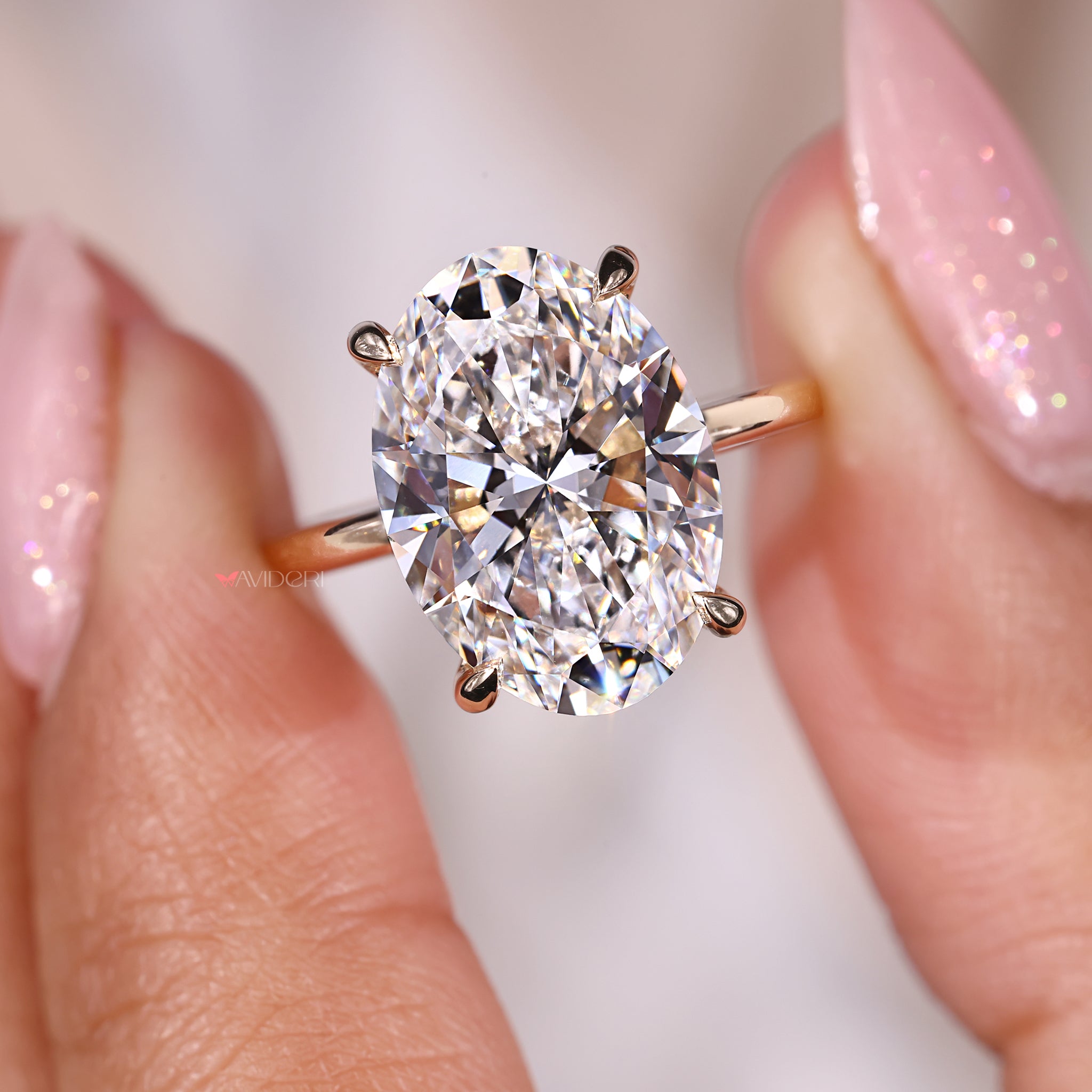 Oval Cut Diamond Ring in yellow gold, offering a classic and timeless design.