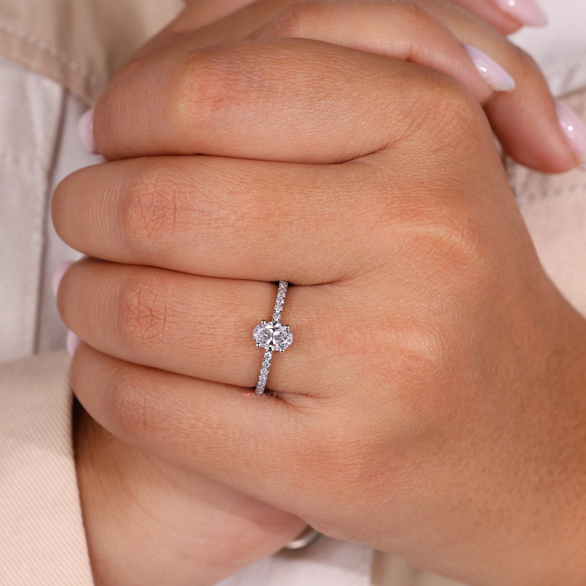 Handmade ring featuring an oval shaped engagement ring for a unique touch.