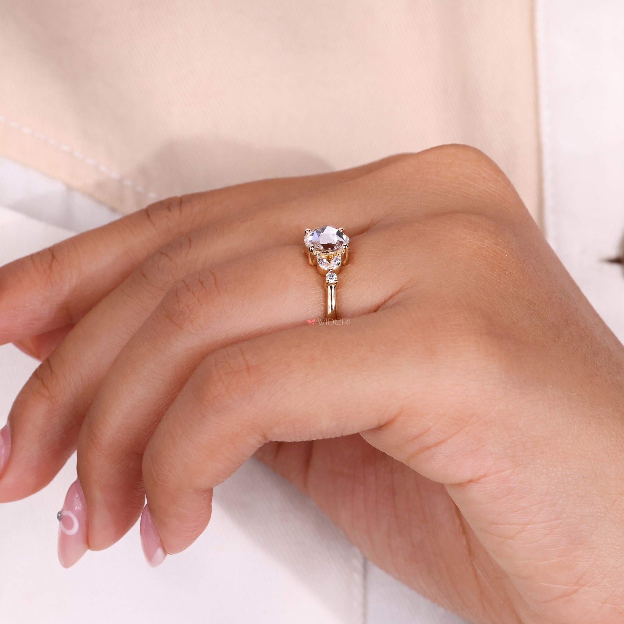 Round cut ring with a sparkling rose cut diamond centerpiece.
