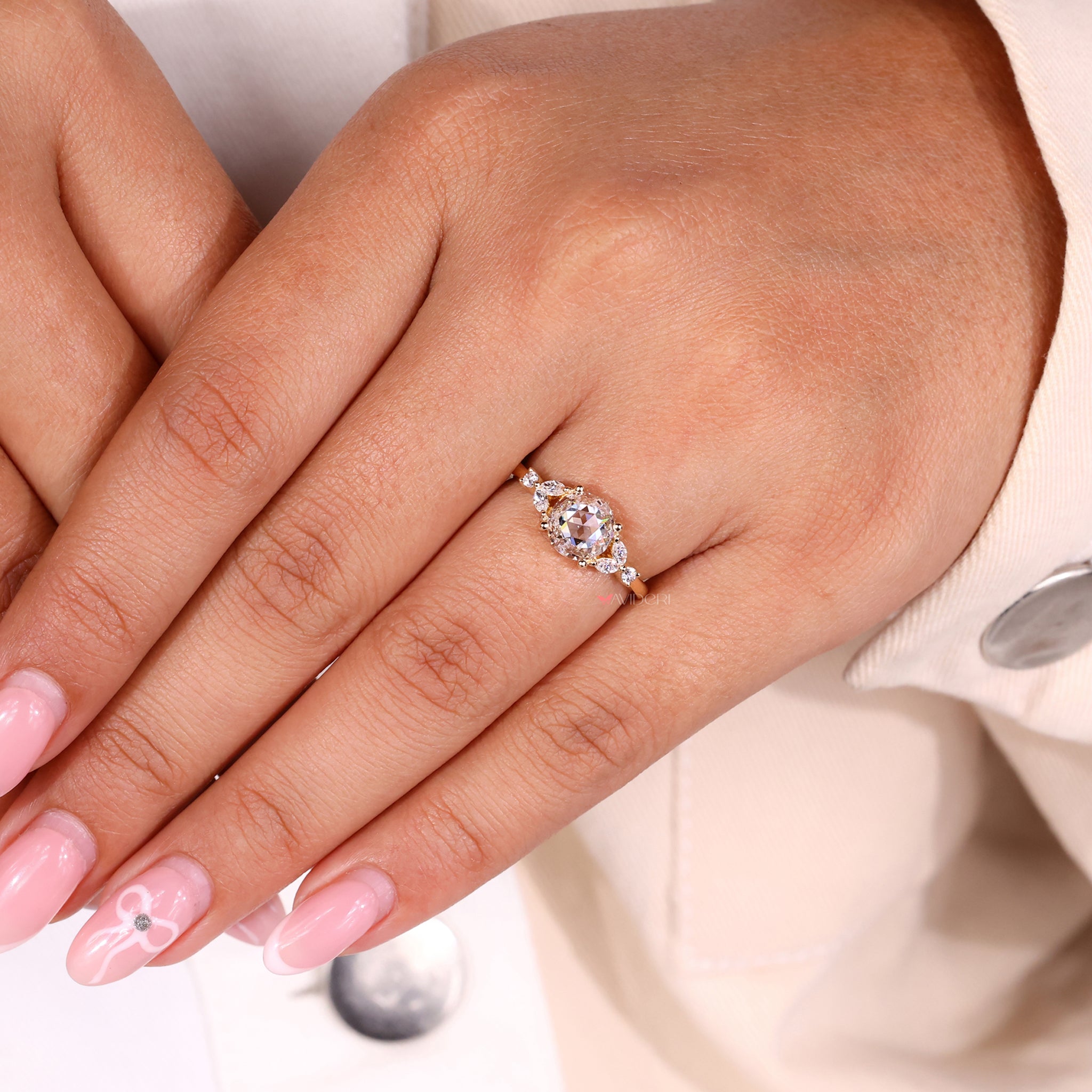 Round engagement ring with a beautiful rose cut diamond setting.