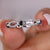 Infinity wedding band with a round cut wedding band design. Infinity wedding band with a round cut wedding band design.