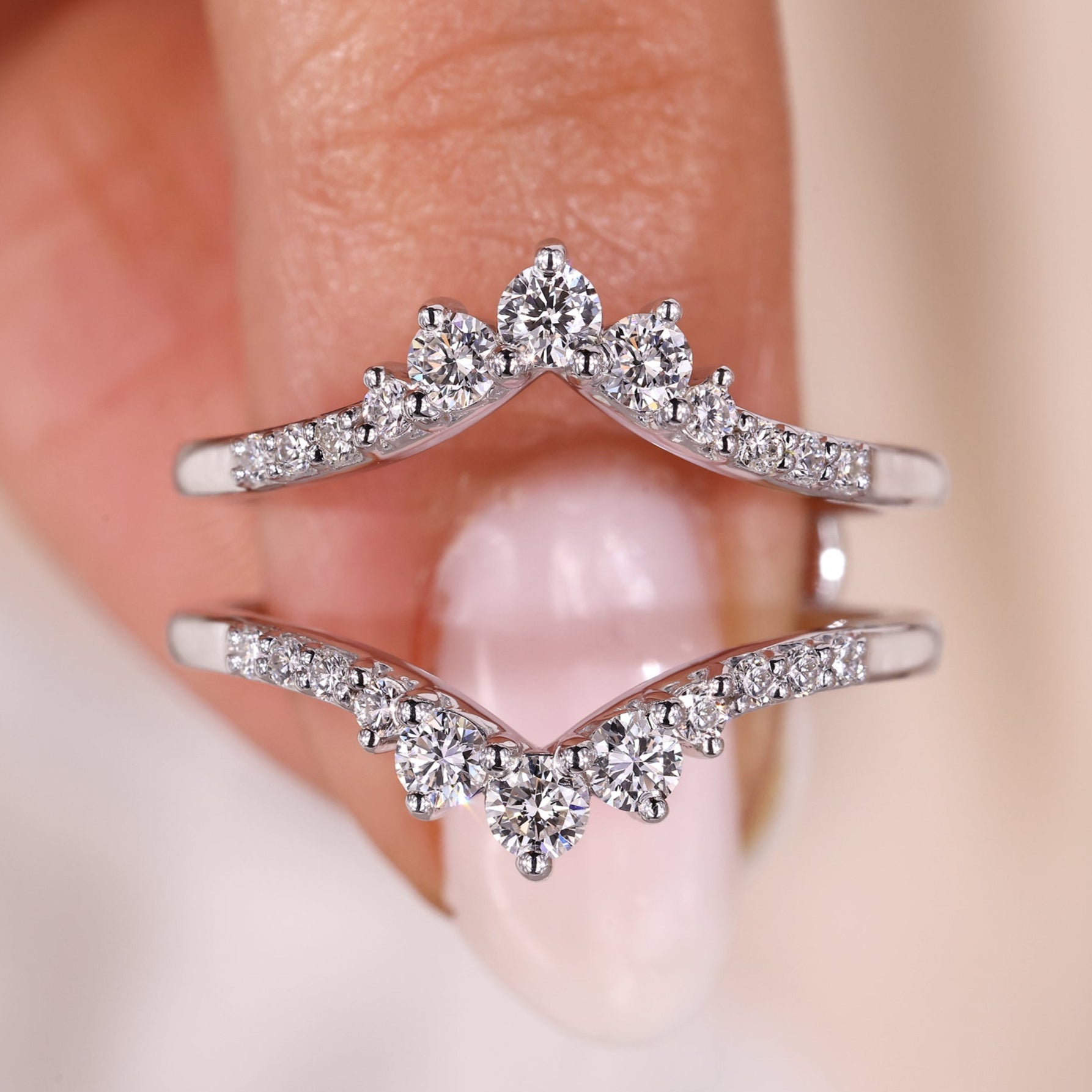 Curved diamond wrap band in shared prong setting.