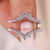 Curved diamond wrap band in shared prong setting. Curved diamond wrap band in shared prong setting.