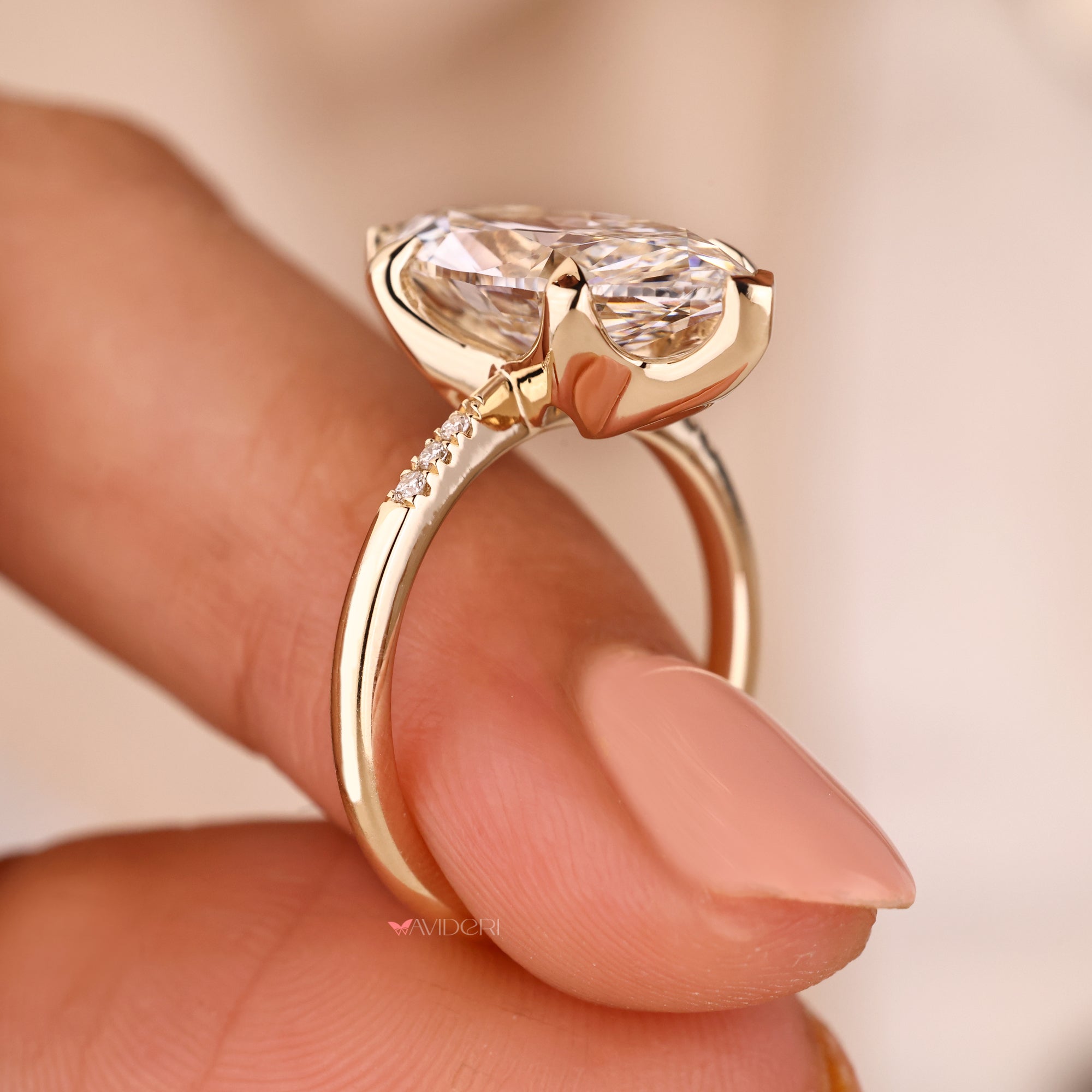 Pave setting diamond ring in a marquise and round combination.