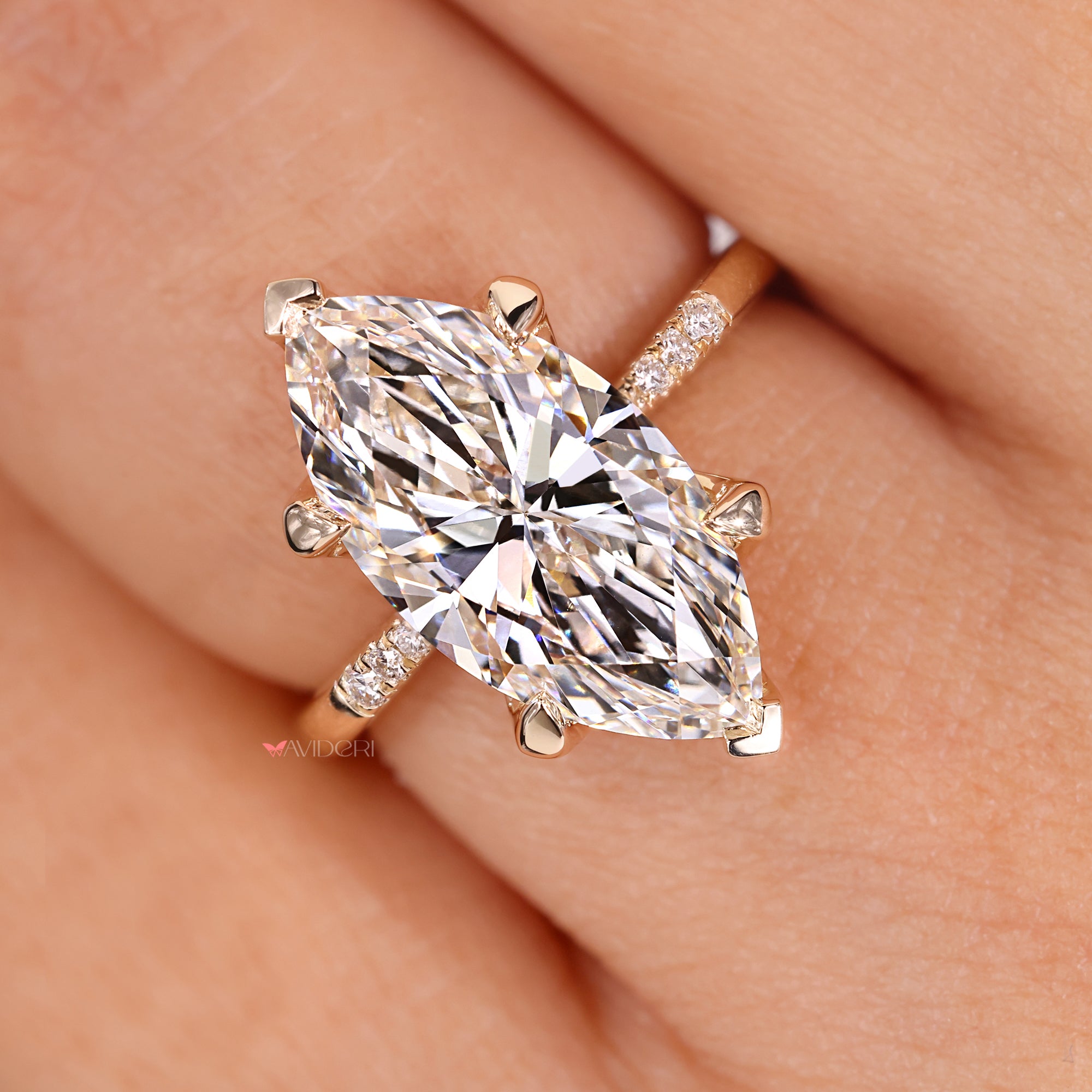 Avideri engagement ring with marquise diamond centerpiece.