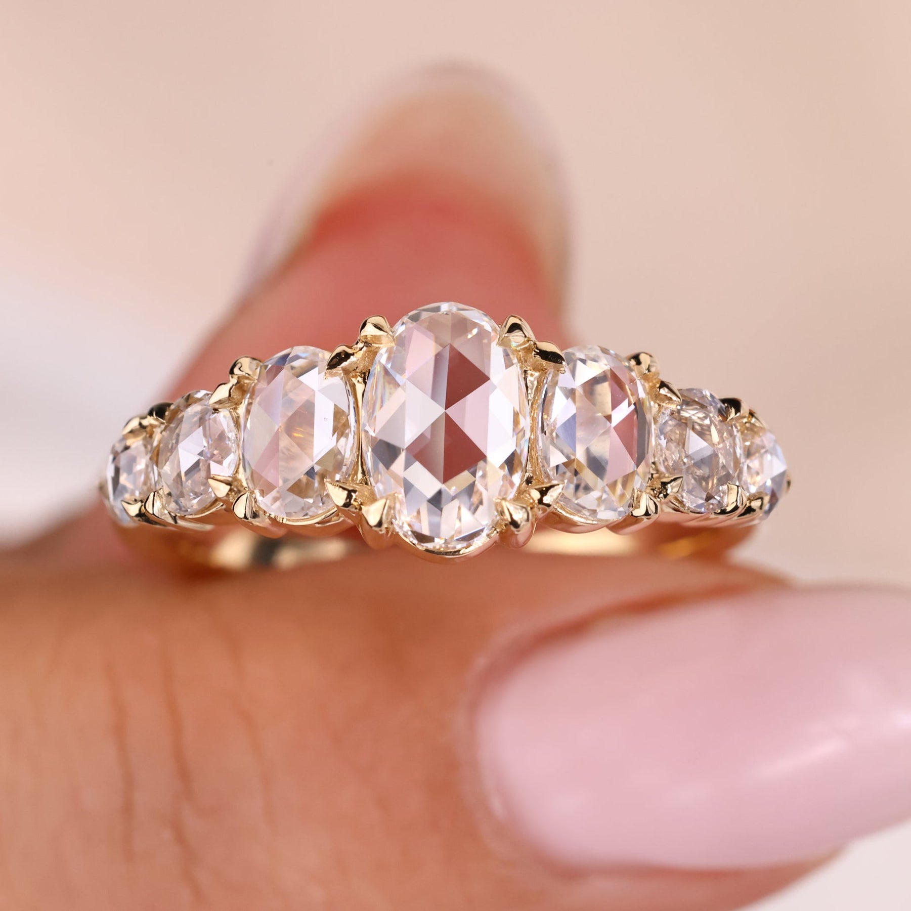 7 stone diamond band with an oval diamond wedding band for a timeless look.
