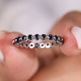 Moissanite eternity band featuring a stunning round wedding band design.