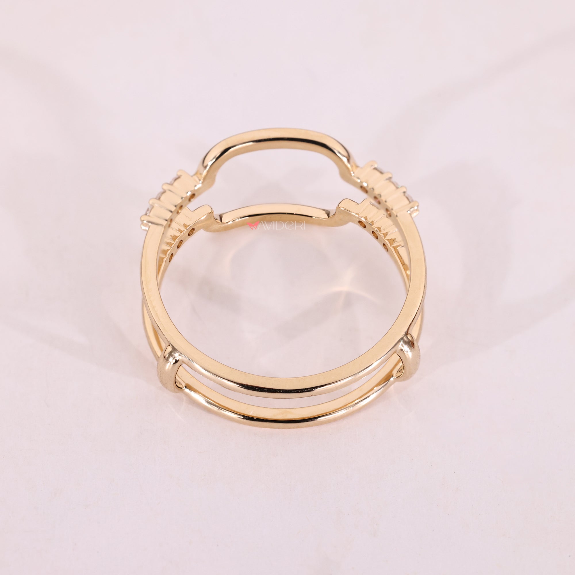 Yellow gold enhancer wedding band with round stones.