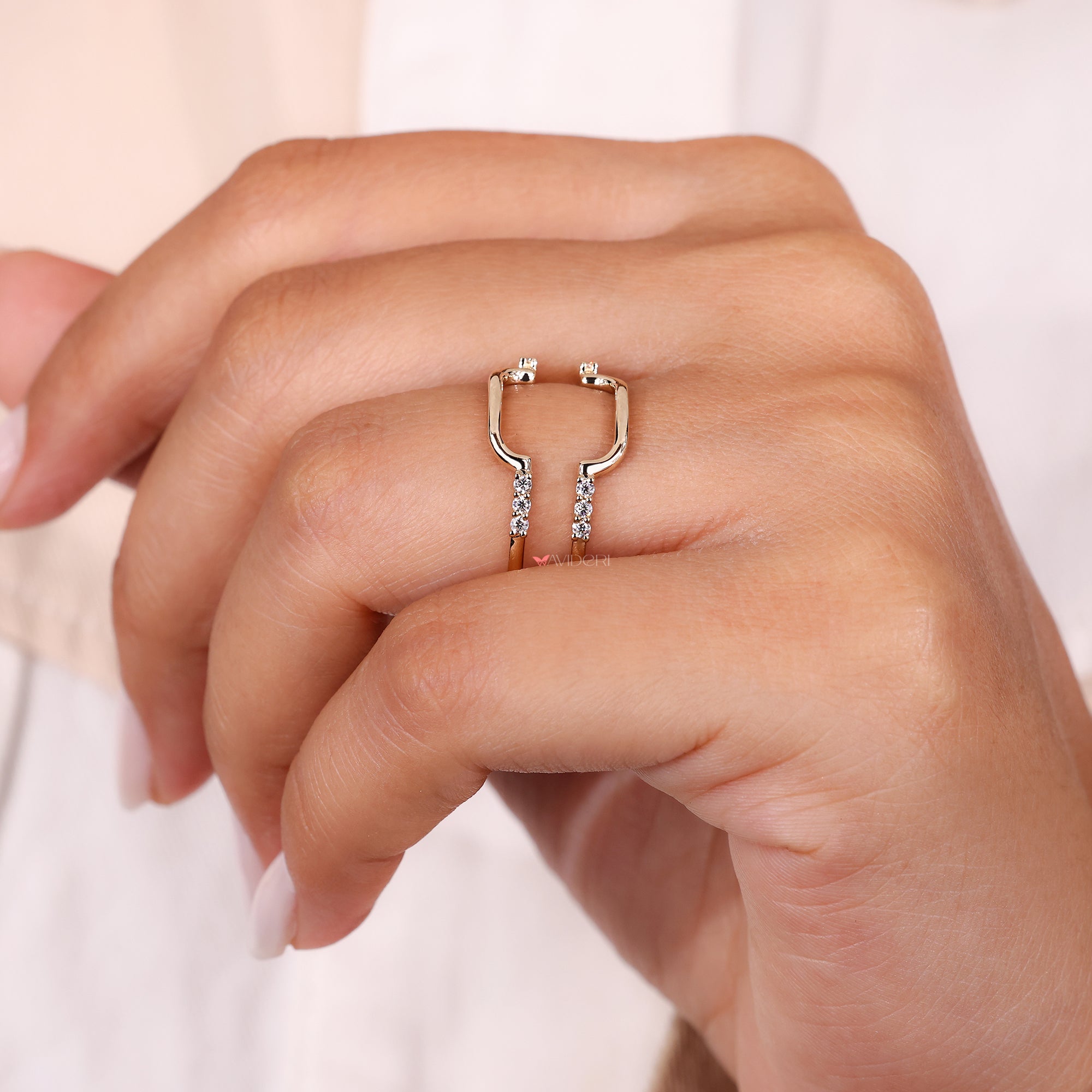 Wedding band enhancer with round moissanite in yellow gold.