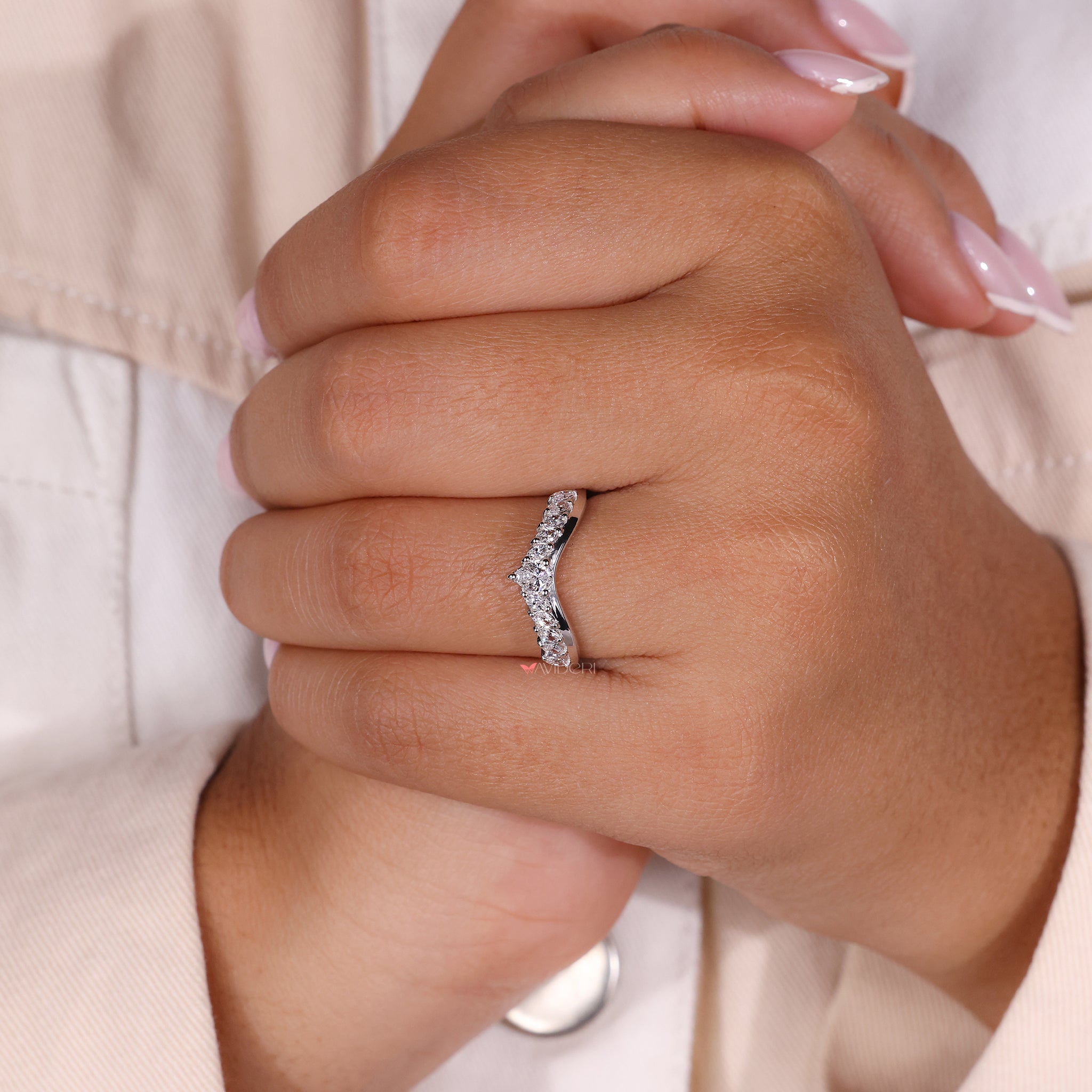 Curved diamond wedding band with a graceful curve.