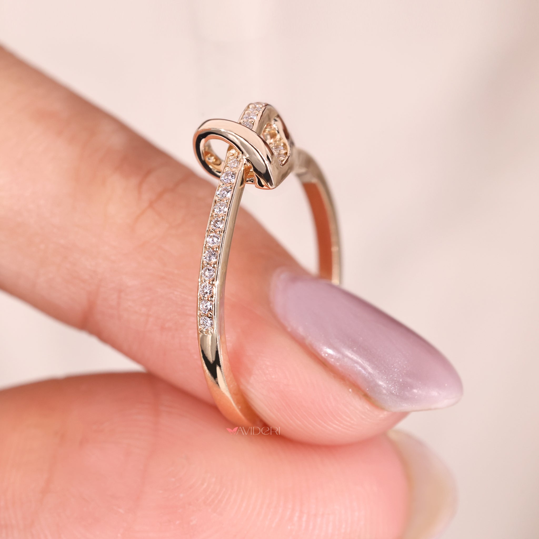 Gold knot band with diamonds crafted for modern engagement styling.