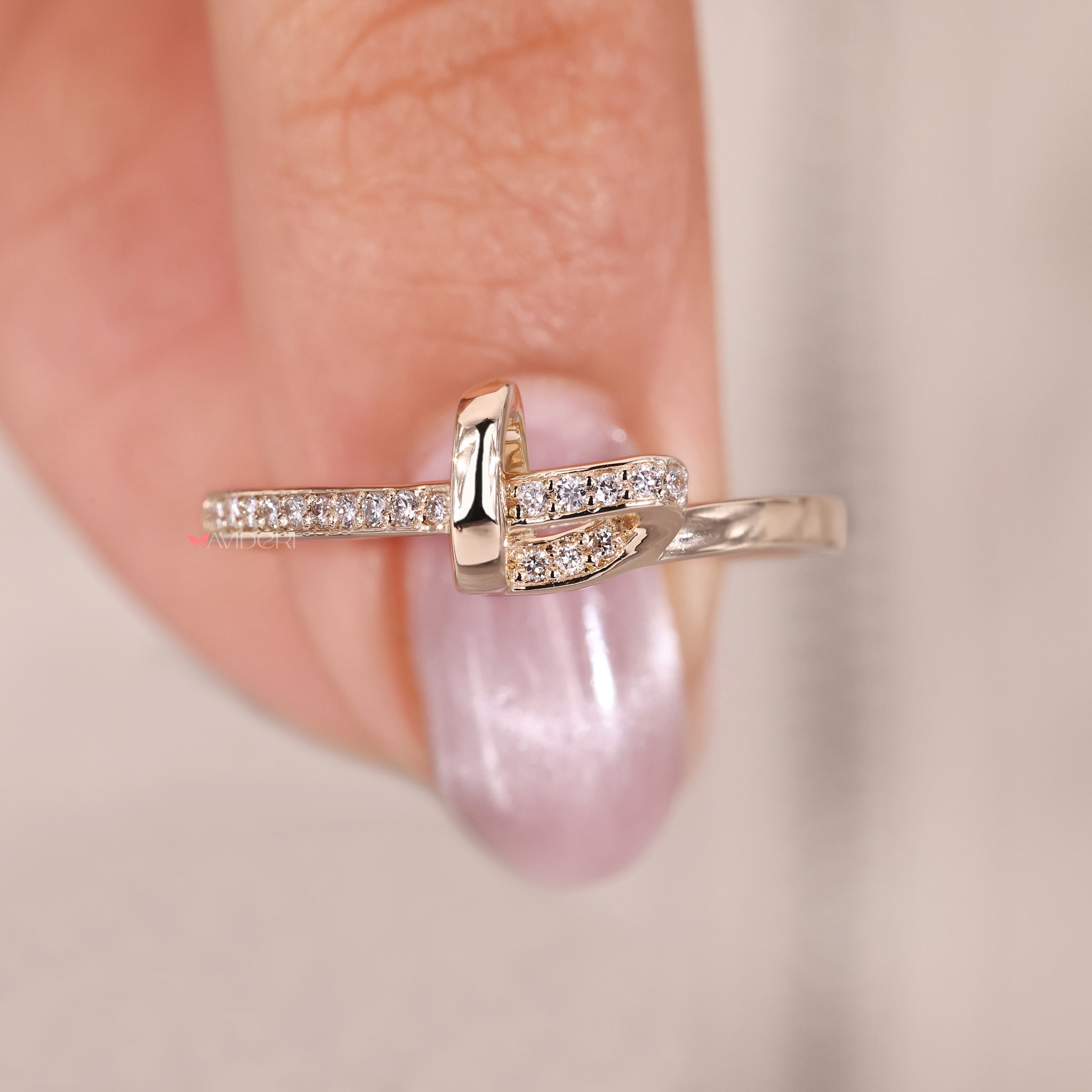 Diamond accent knot band designed to represent unity and love.