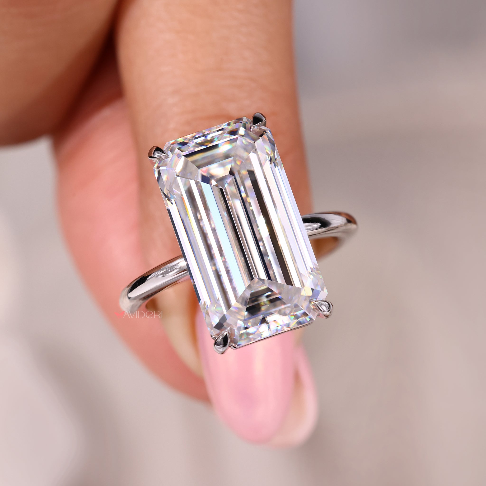 Handmade ring with a big moissanite stone and 4 claw prong setting.