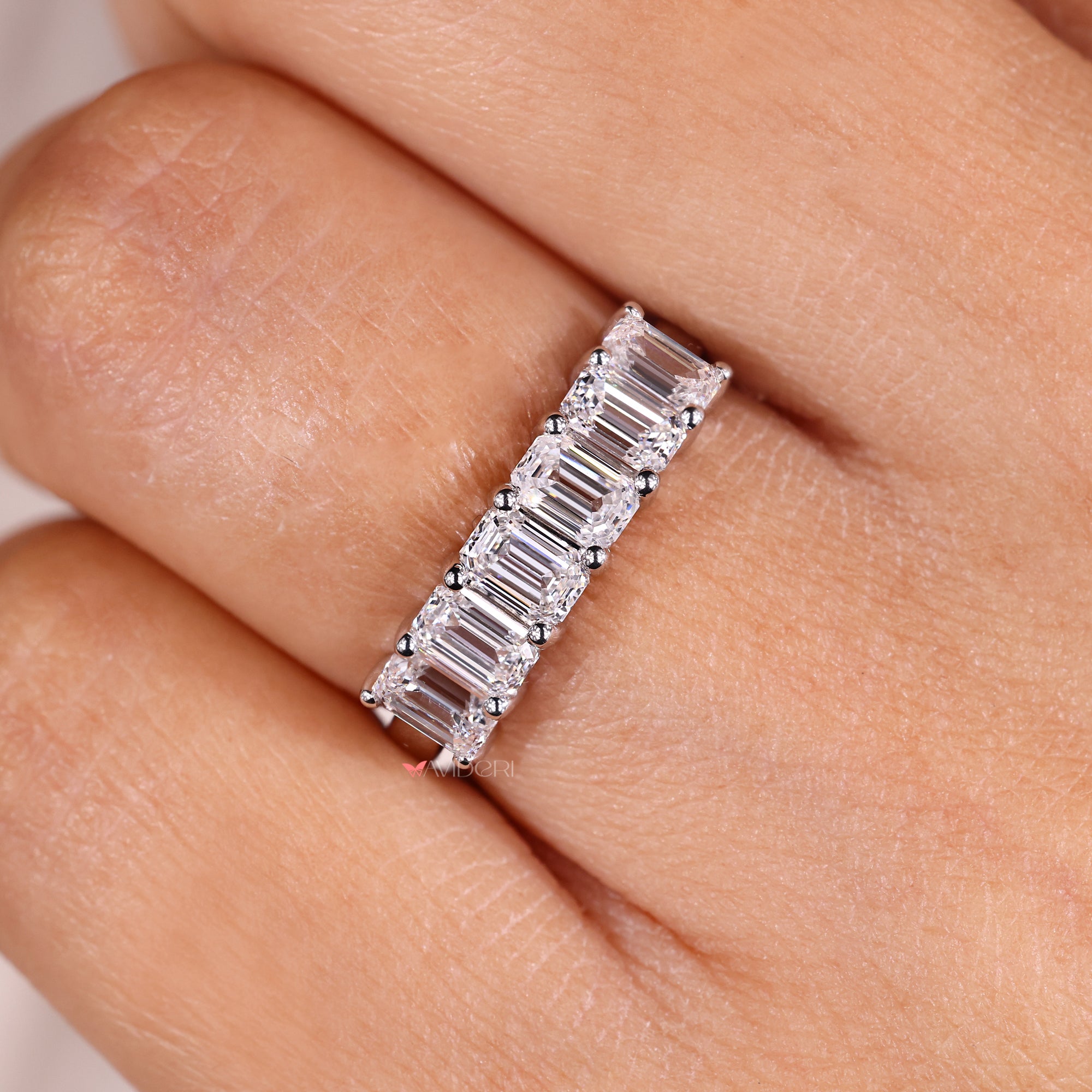 Six diamond wedding band with shared prong setting.