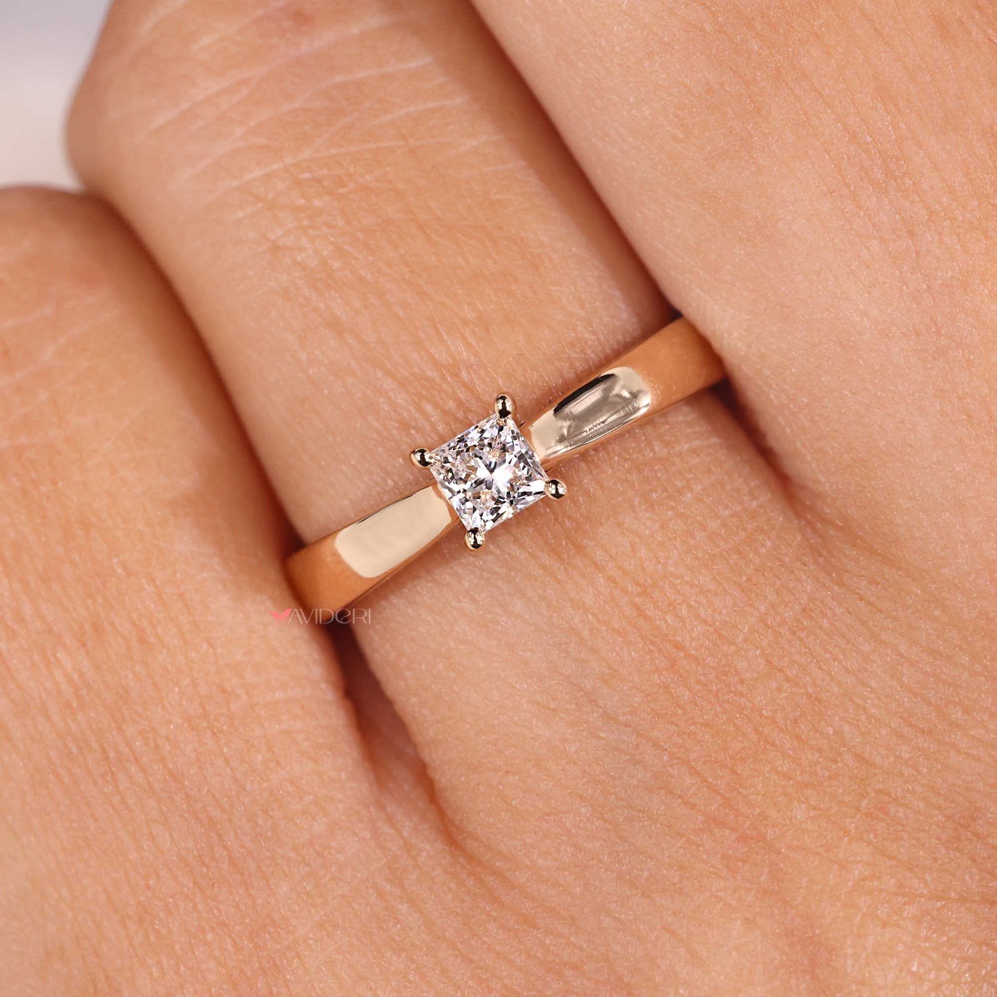 Four prong setting engagement ring with a princess diamond, ensuring a secure fit.