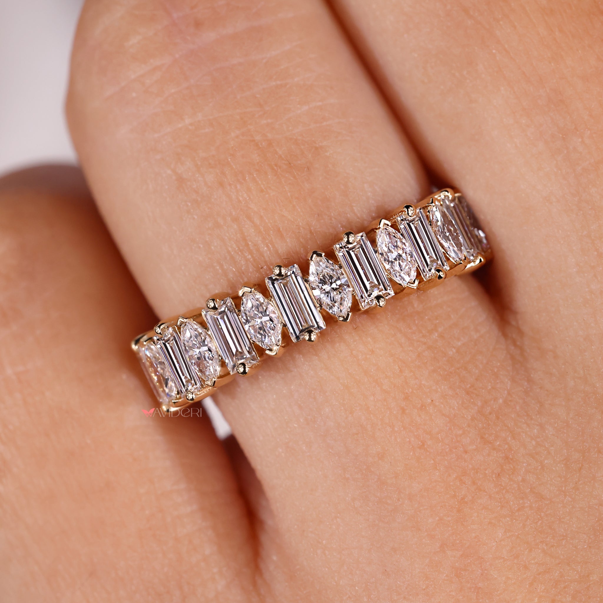 Handmade wedding band featuring baguette-cut diamonds.