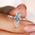 Marquise diamond engagement ring with a compass prong setting.