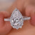 Halo diamond engagement ring featuring a stunning pear shaped diamond ring design.
 Halo diamond engagement ring featuring a stunning pear shaped diamond ring design.