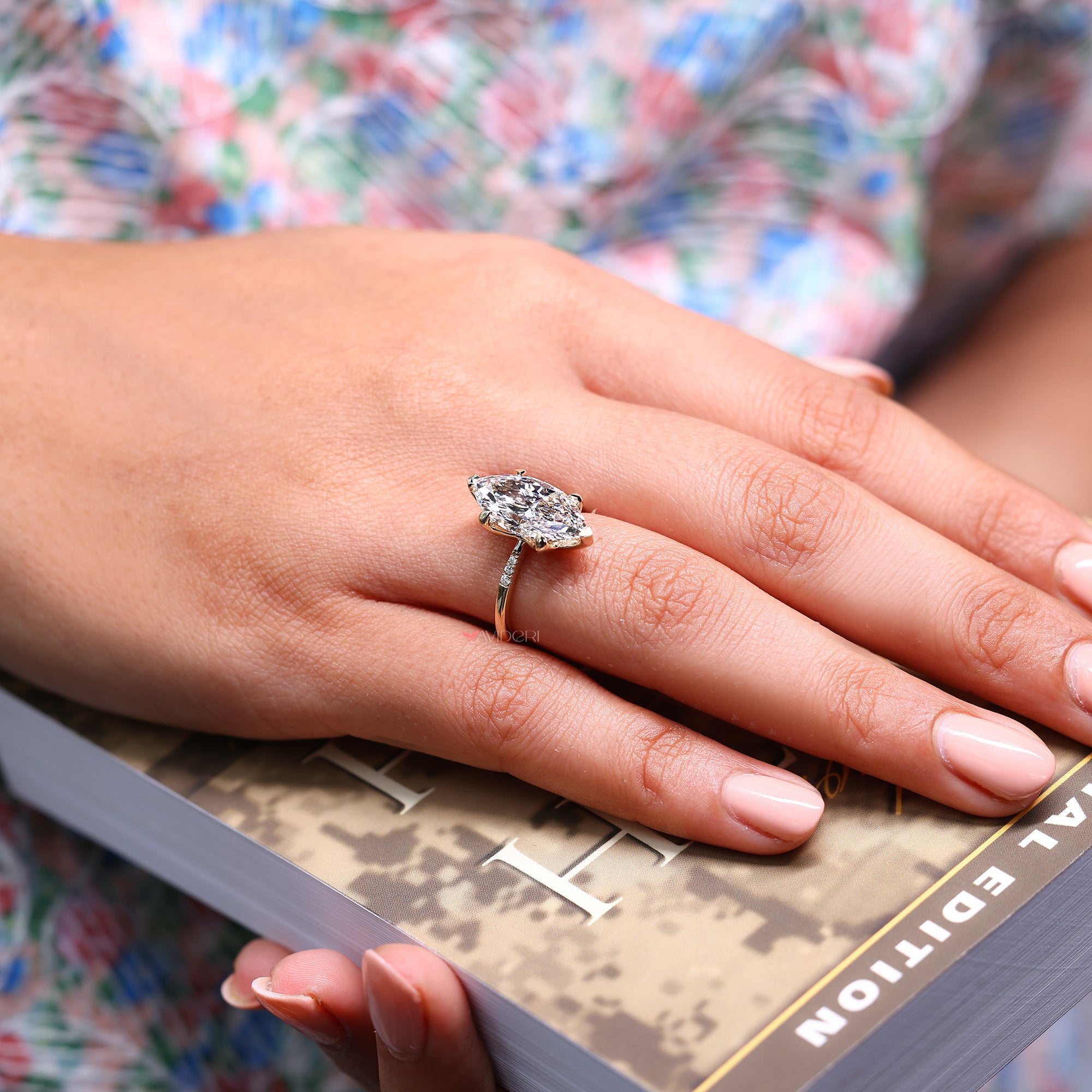 Tapered shank diamond ring with lab grown marquise diamond.